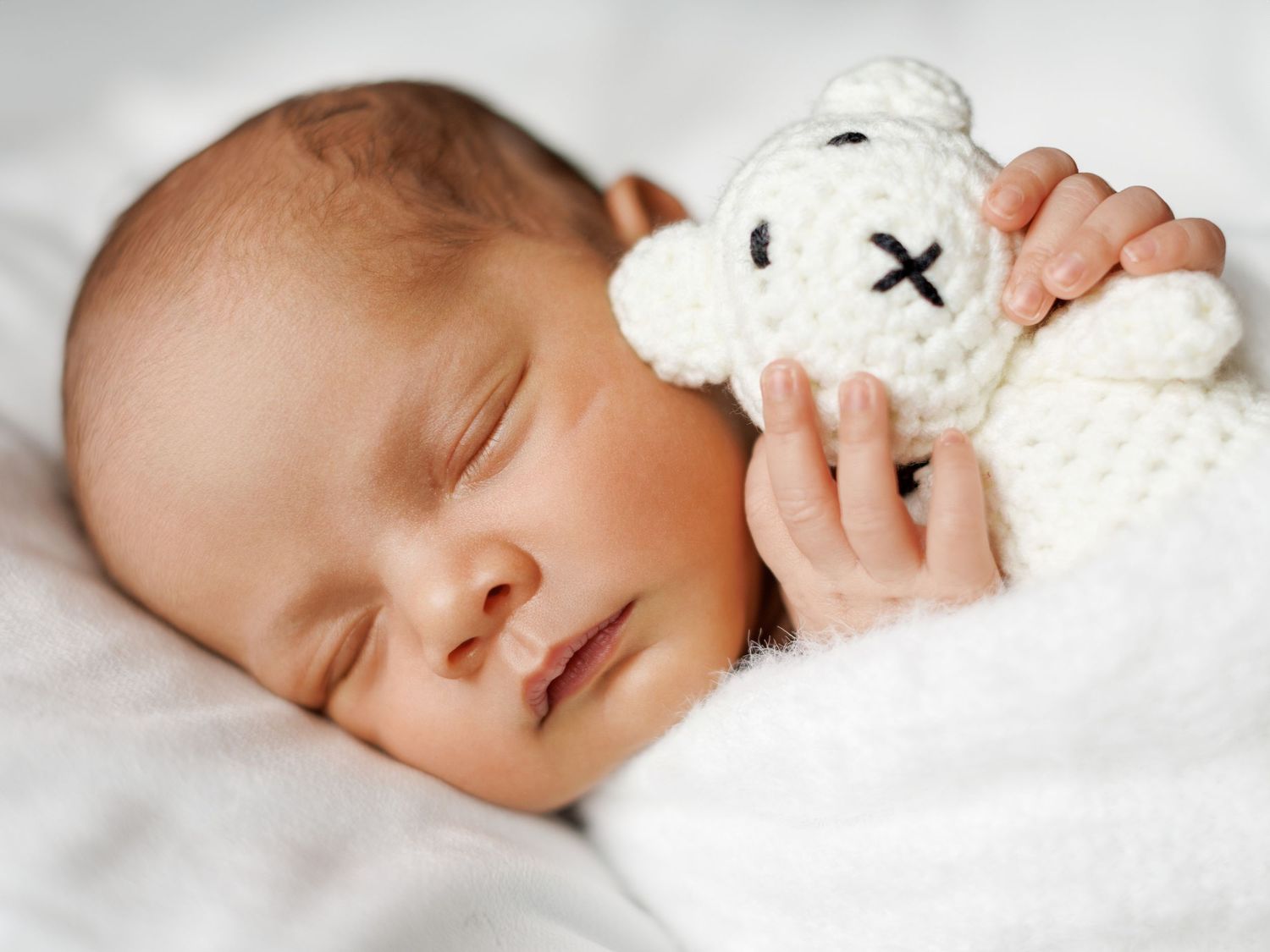 Newborn photography portrait of a baby in a calm studio environment