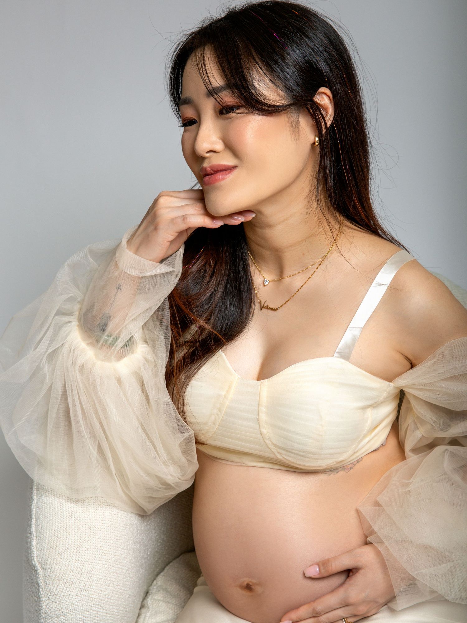 Studio maternity photography session focused on connection and form