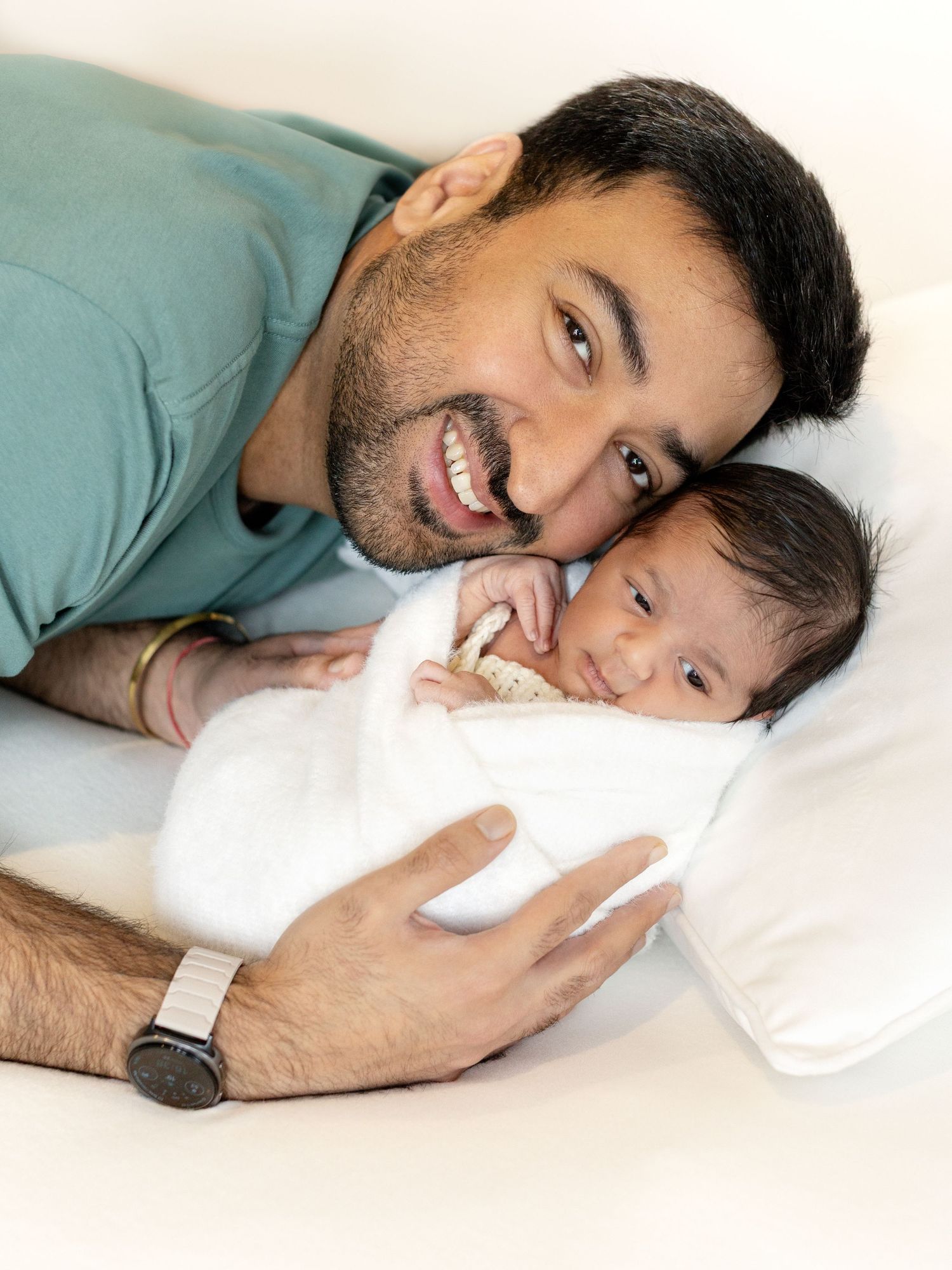 Newborn photoshoot with soft fabrics and minimal styling