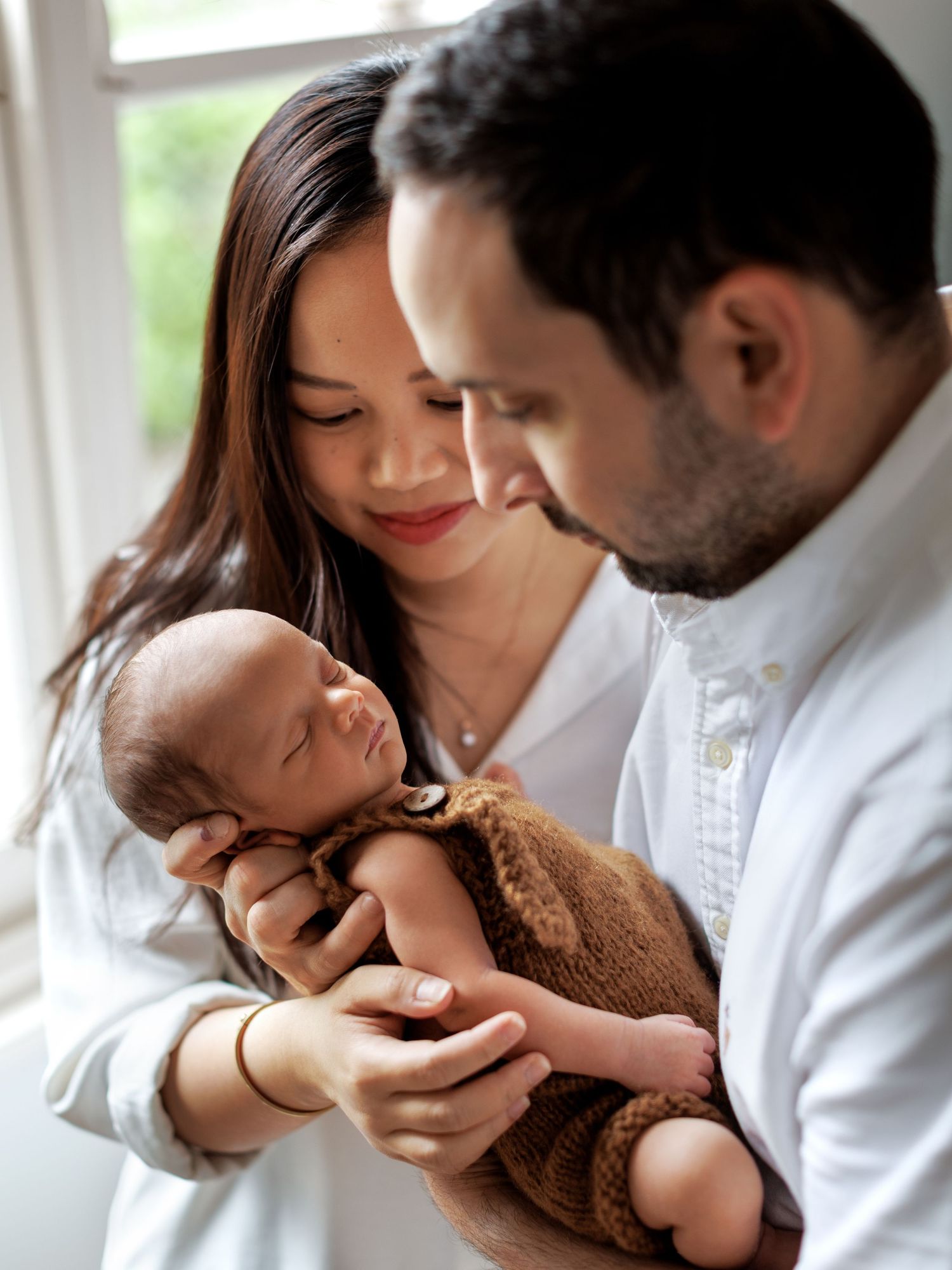 Studio newborn photography session capturing baby’s tiny features