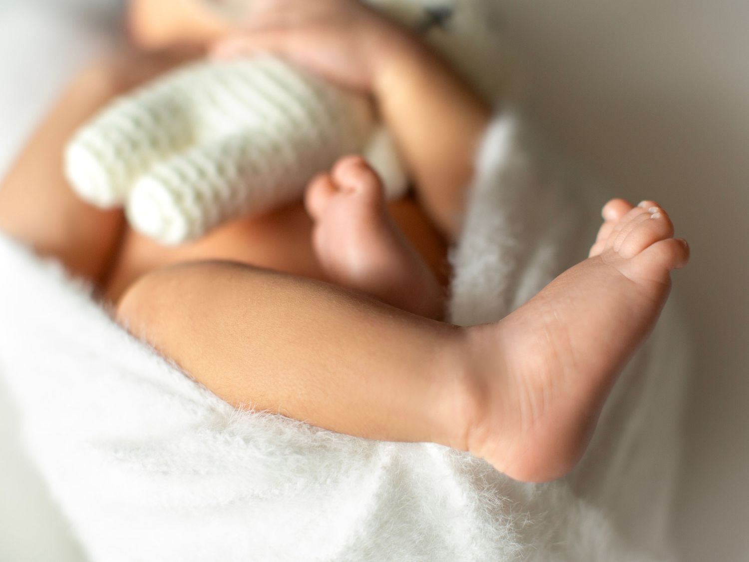 Newborn photoshoot capturing peaceful and timeless imagery