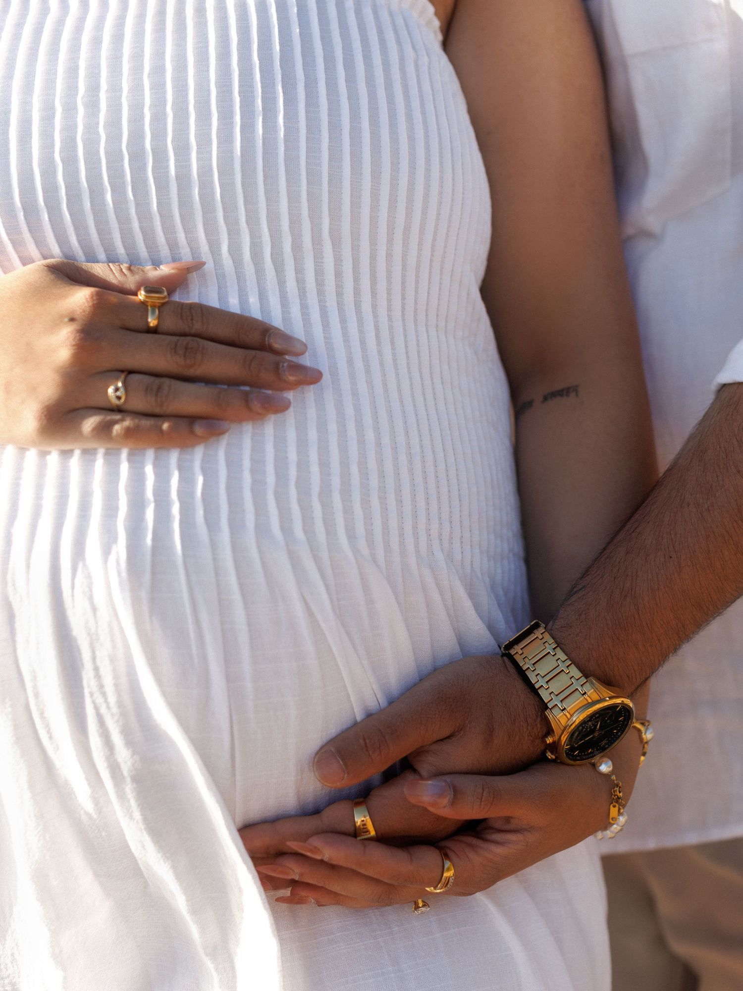 Maternity photography capturing motherhood by the ocean