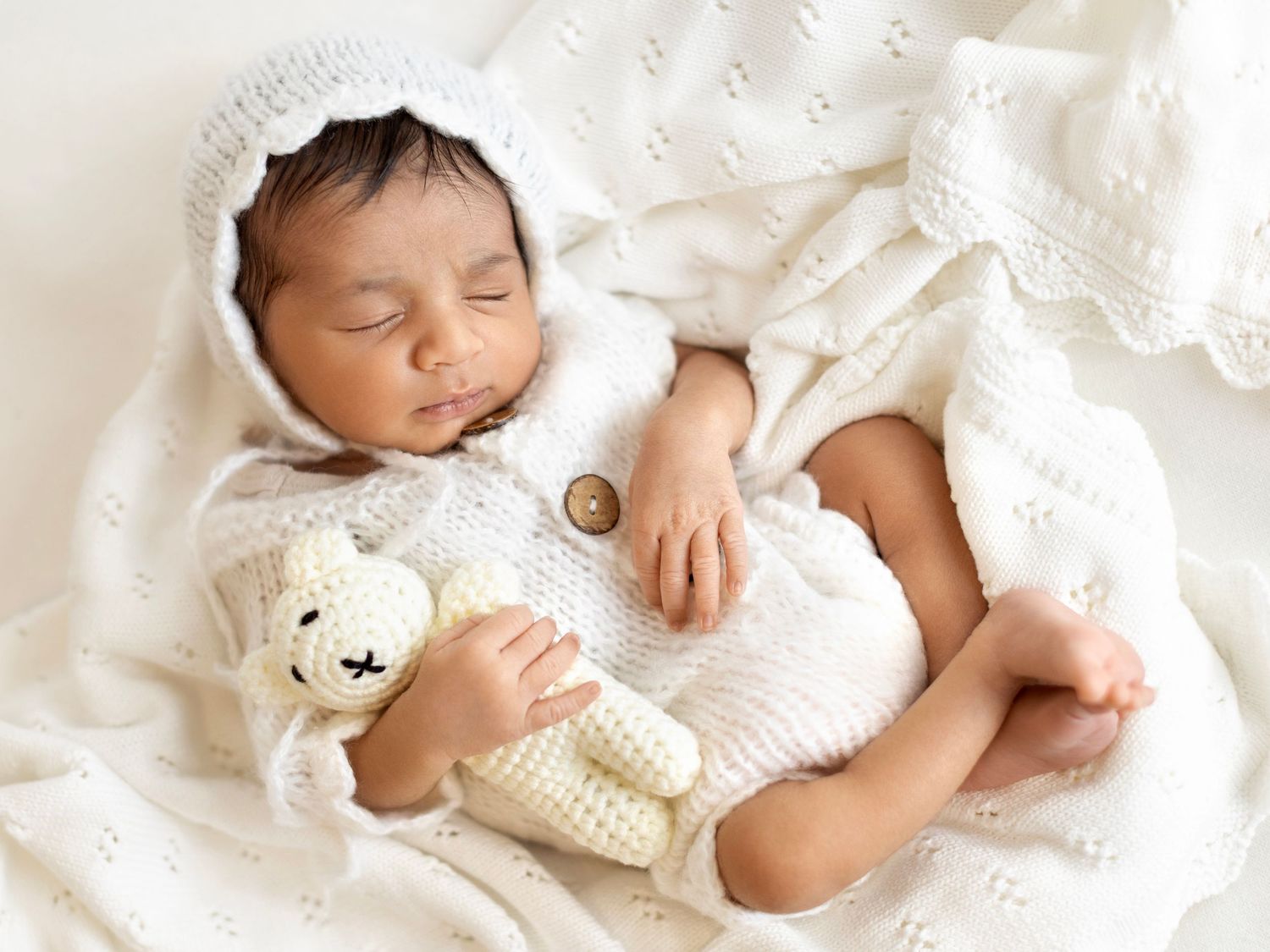 Natural newborn photography session in a calm studio setting