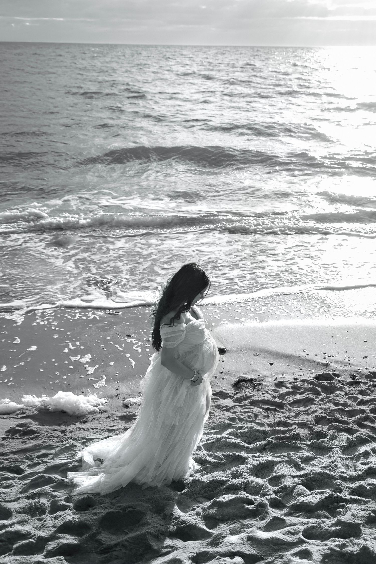 Natural maternity photoshoot with soft light and gentle posing