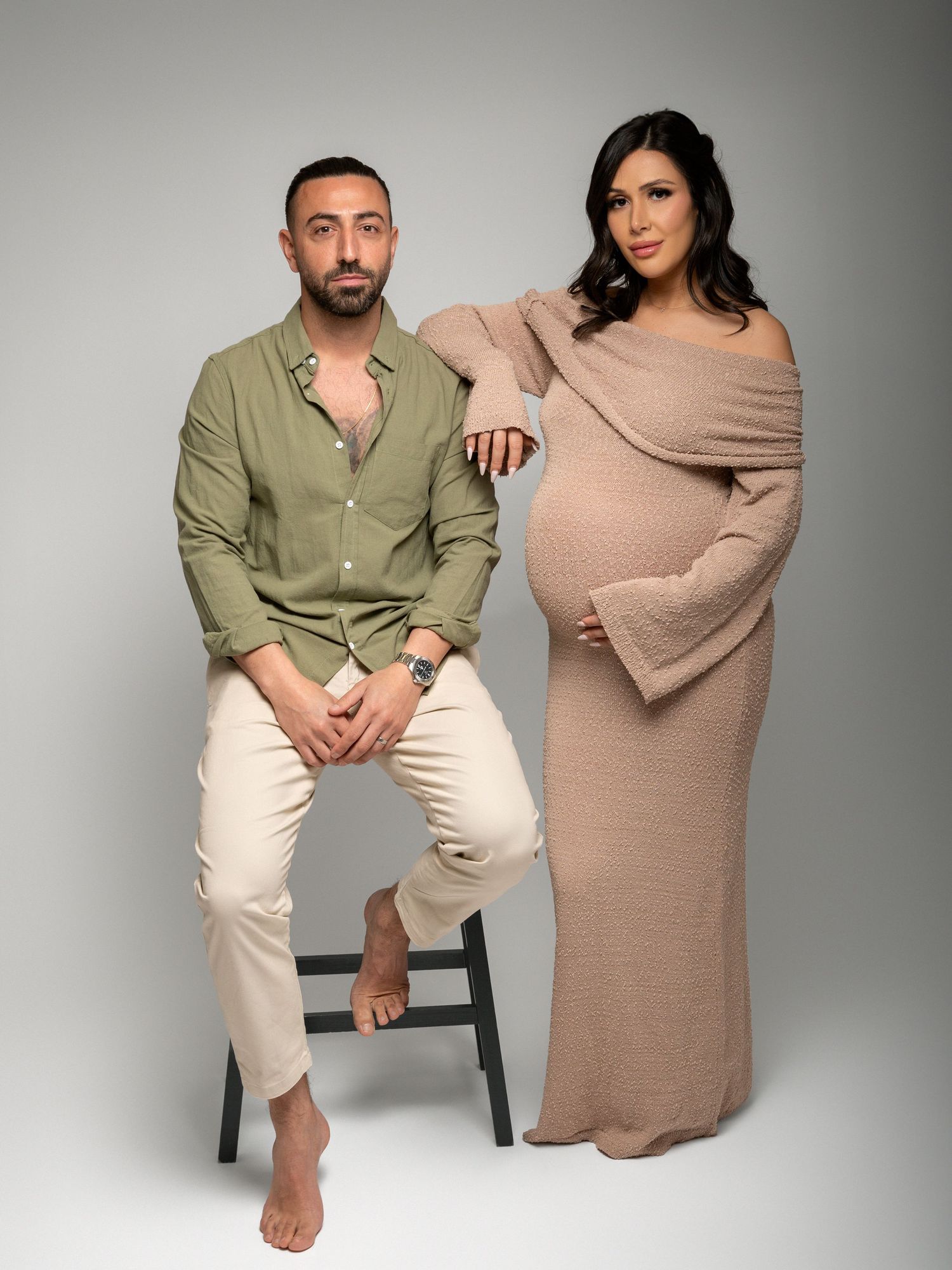 Studio maternity photography highlighting baby bump details