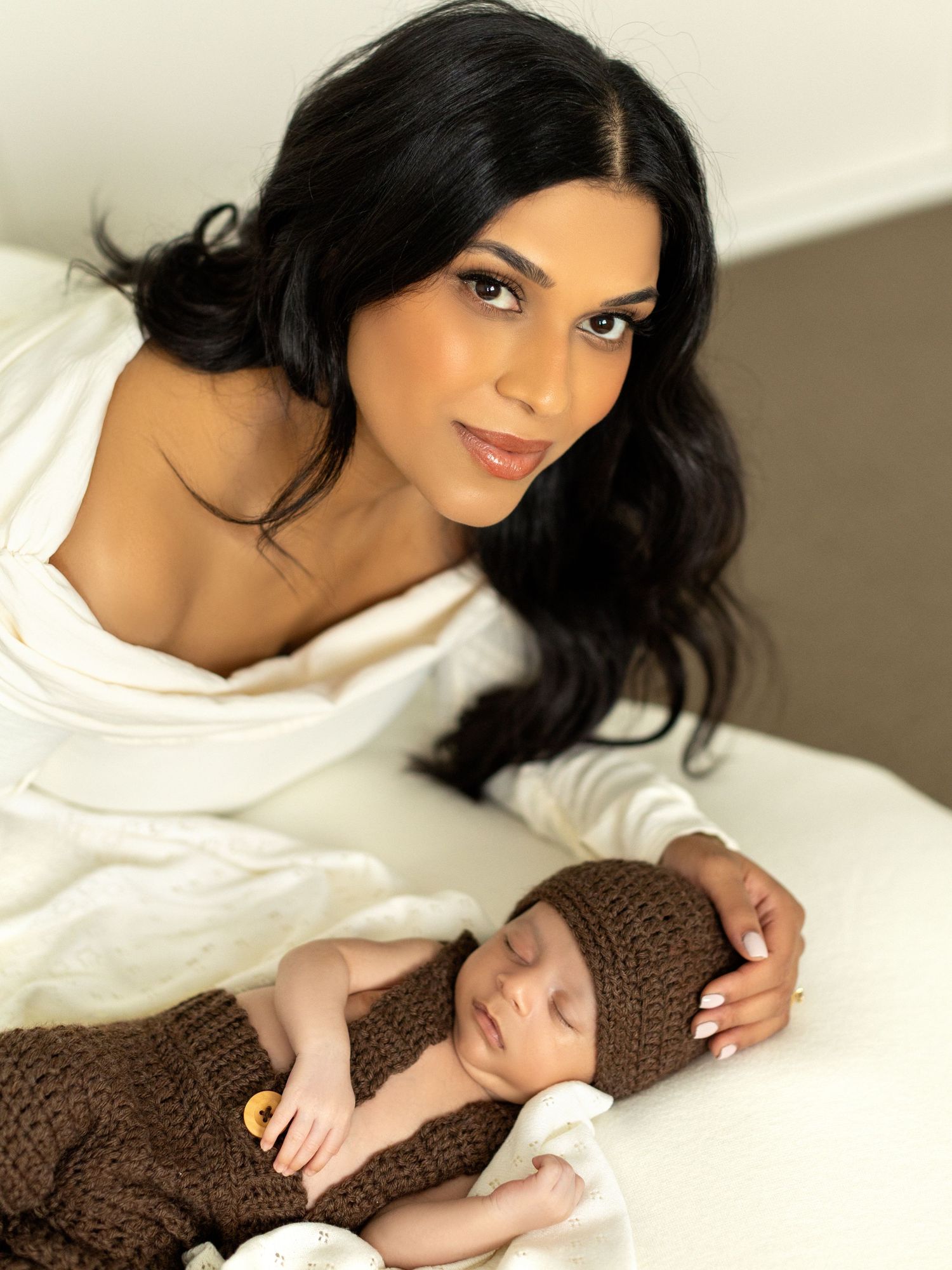 Natural newborn photography capturing a calm studio moment