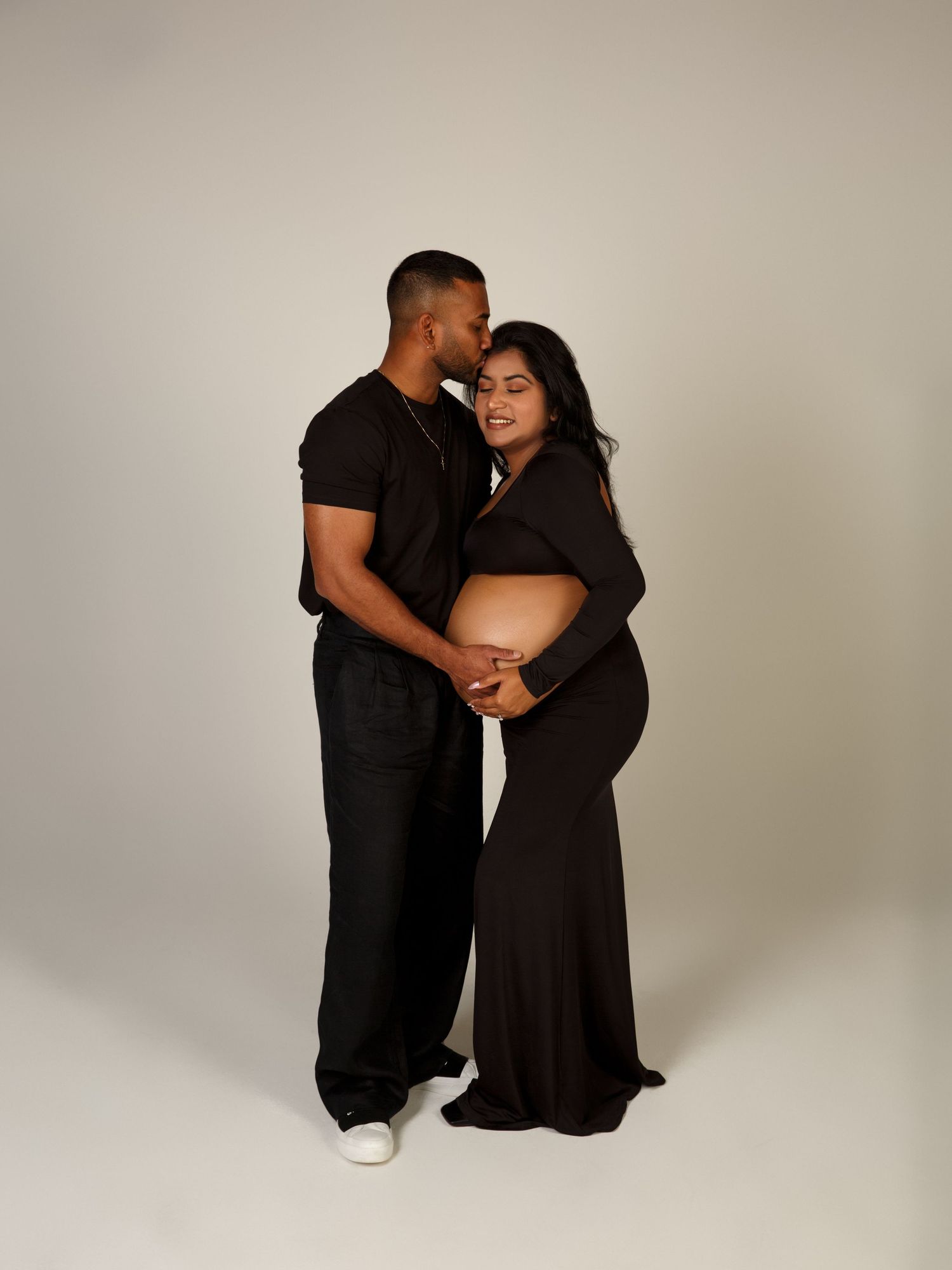 Pregnancy photography session with soft textures and light