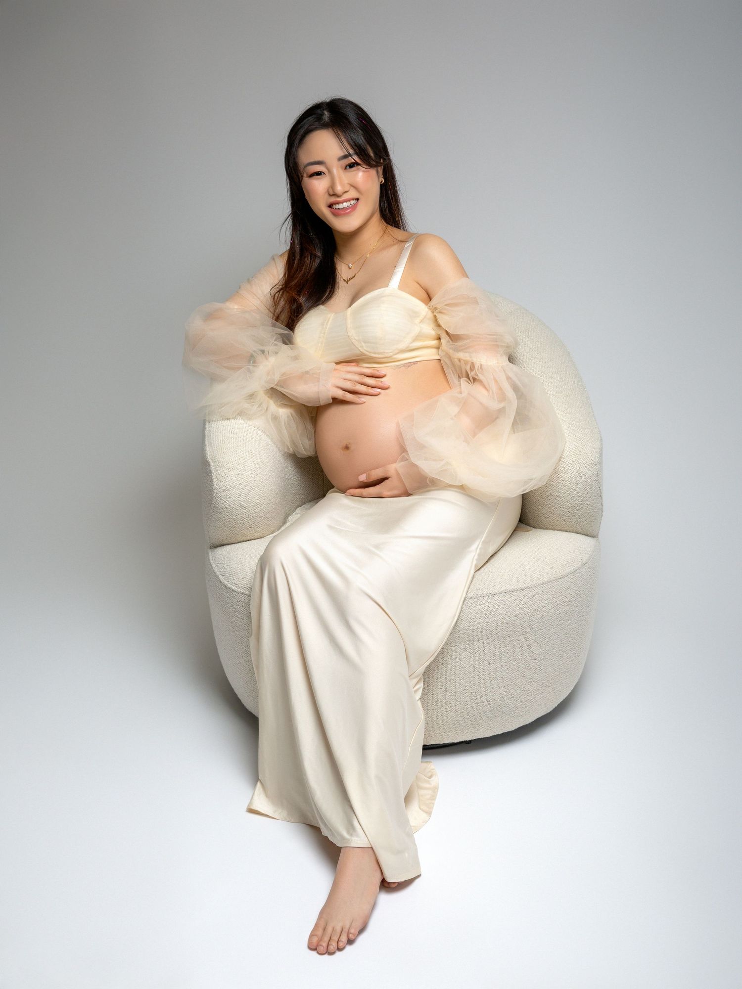 Maternity photoshoot in a professional studio with natural light