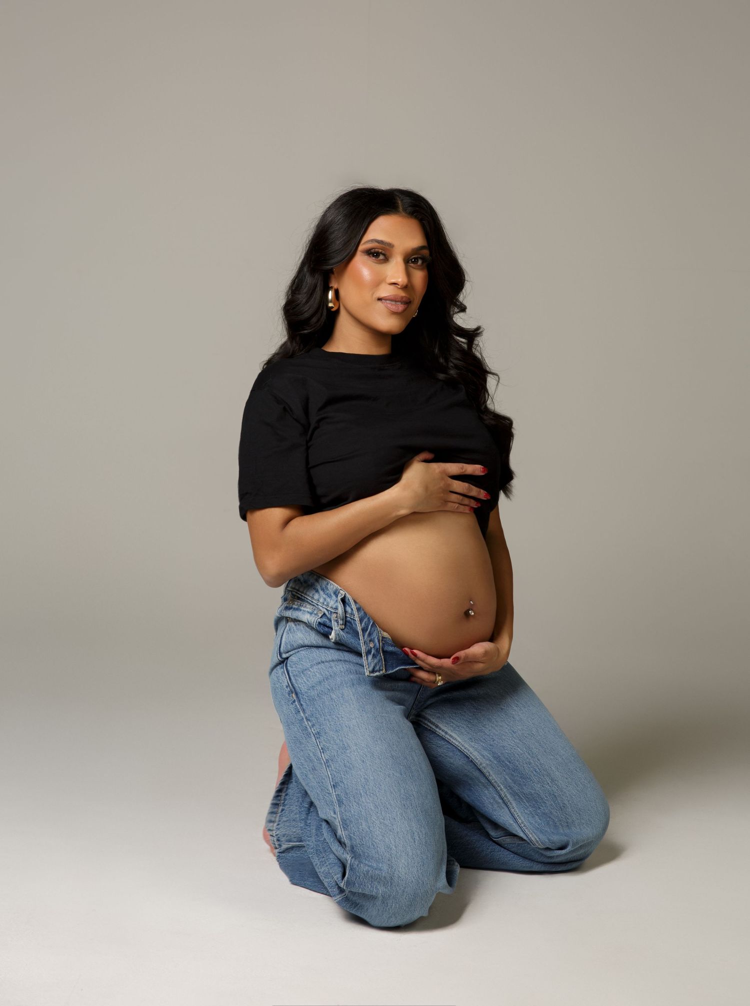 Professional studio maternity photography with balanced lighting