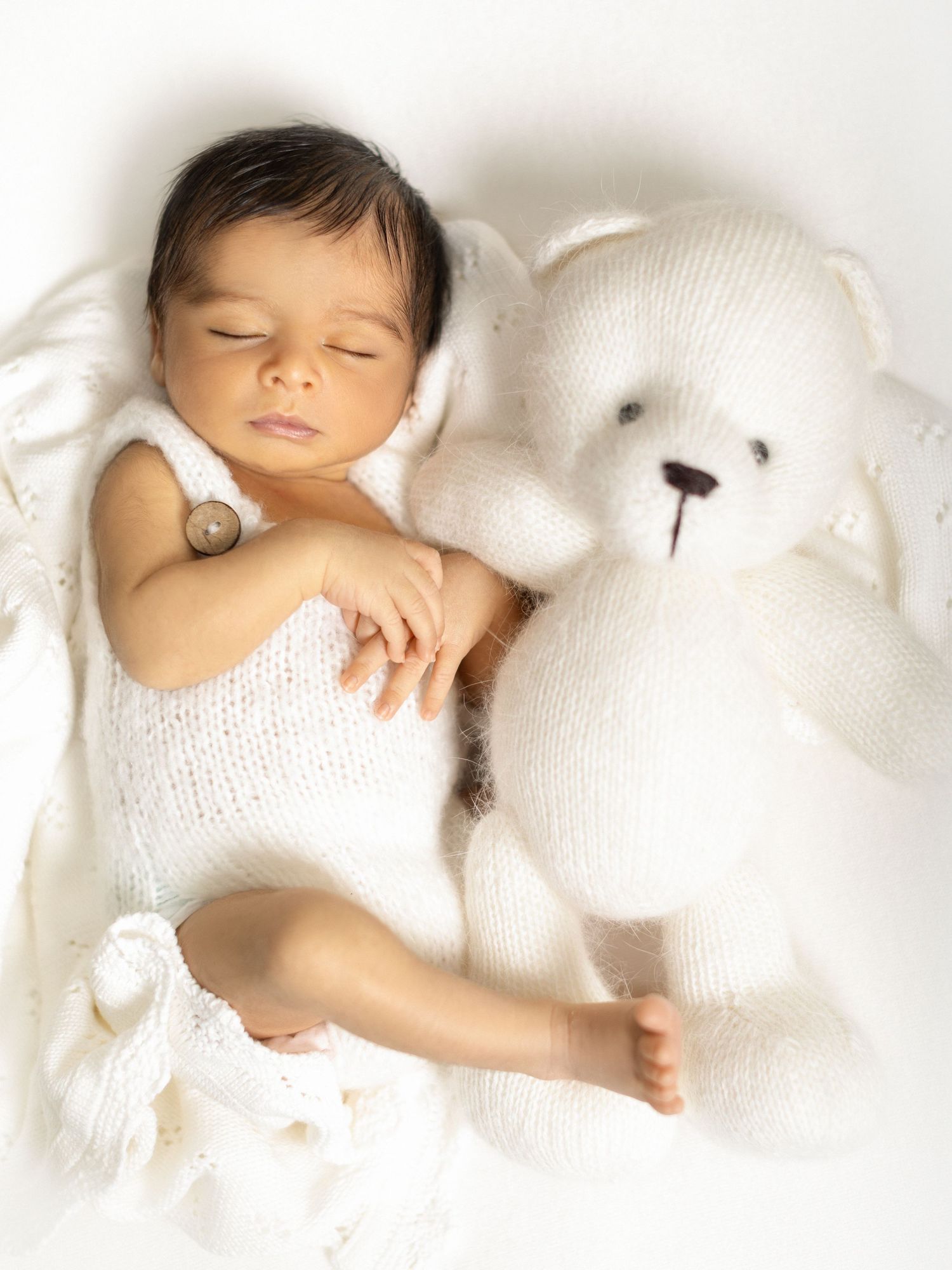 Gentle newborn photography session in a professional studio