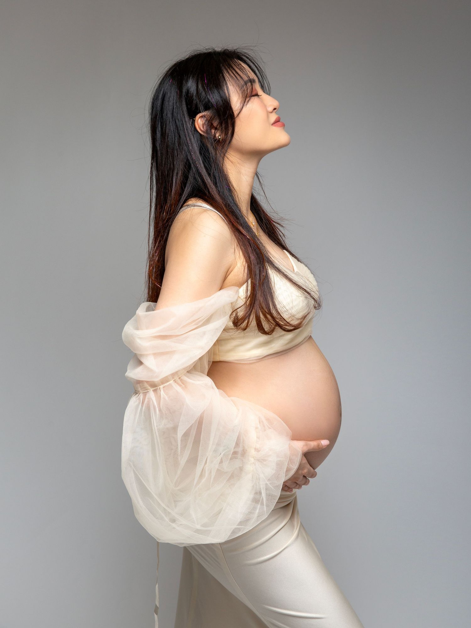 Studio pregnancy photography capturing timeless maternity portraits