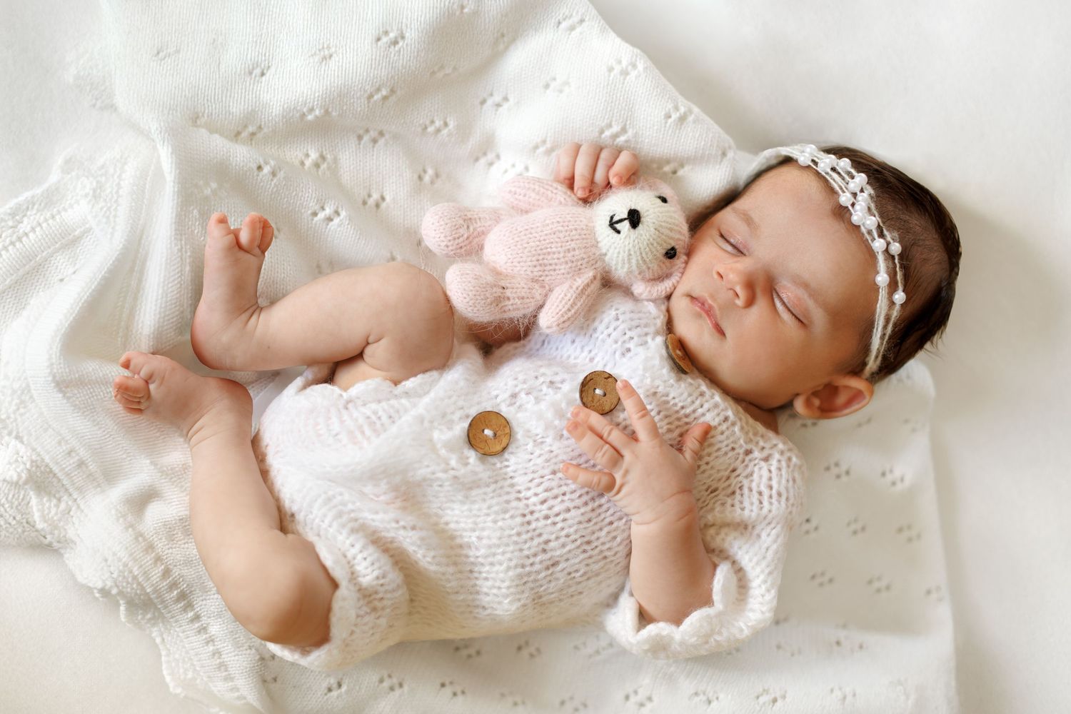 Natural newborn photography capturing a baby in a calm studio setting
