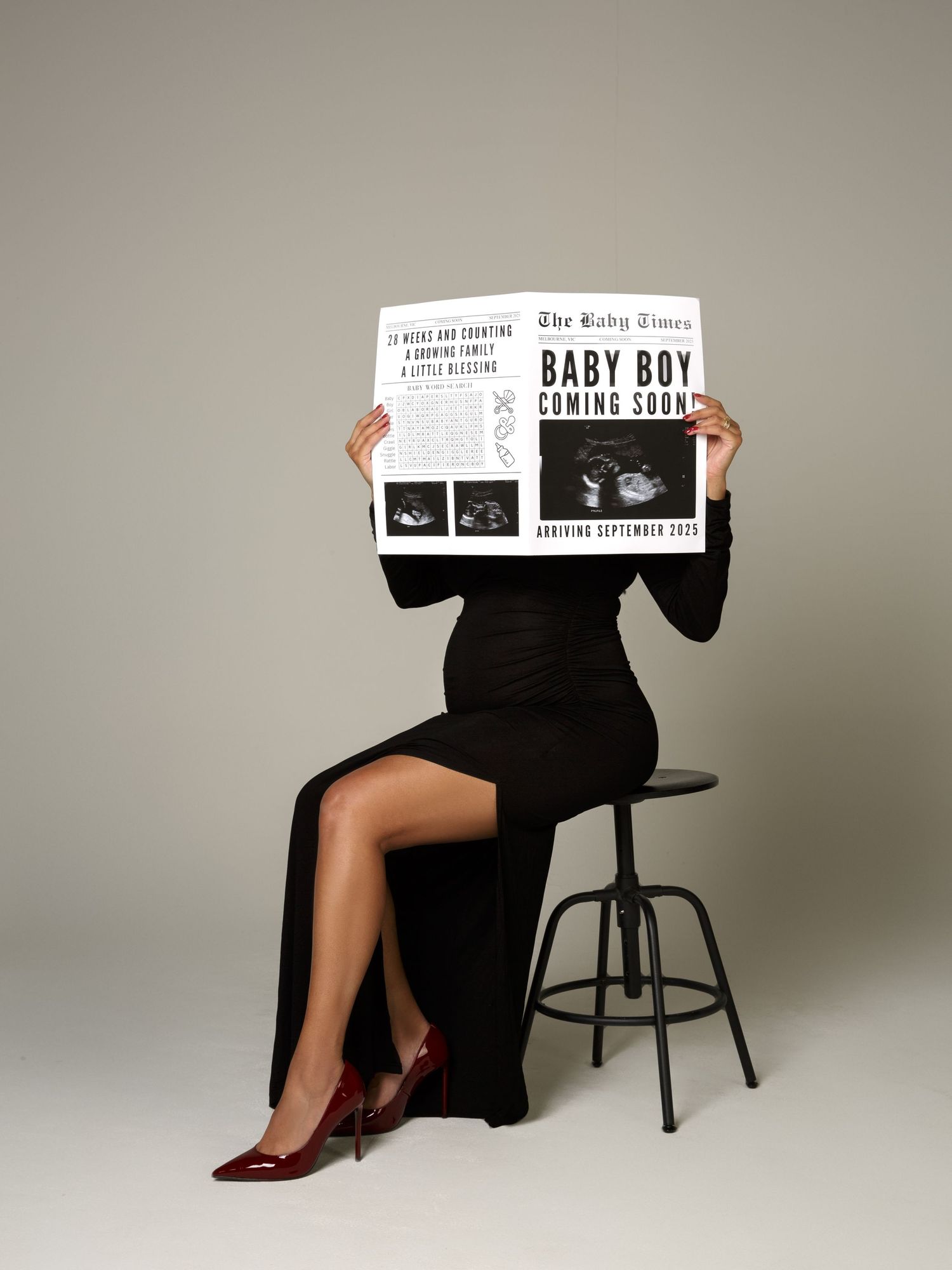 Pregnancy photography portrait captured under professional studio lighting