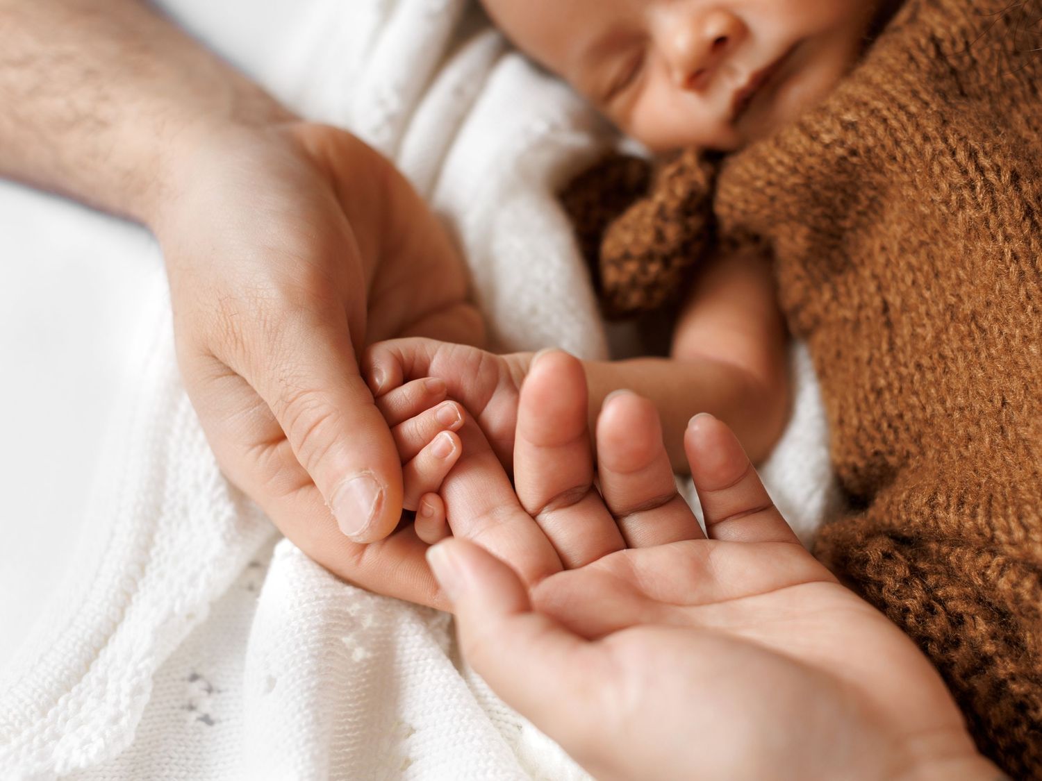 Calm studio newborn photography with soft textures
