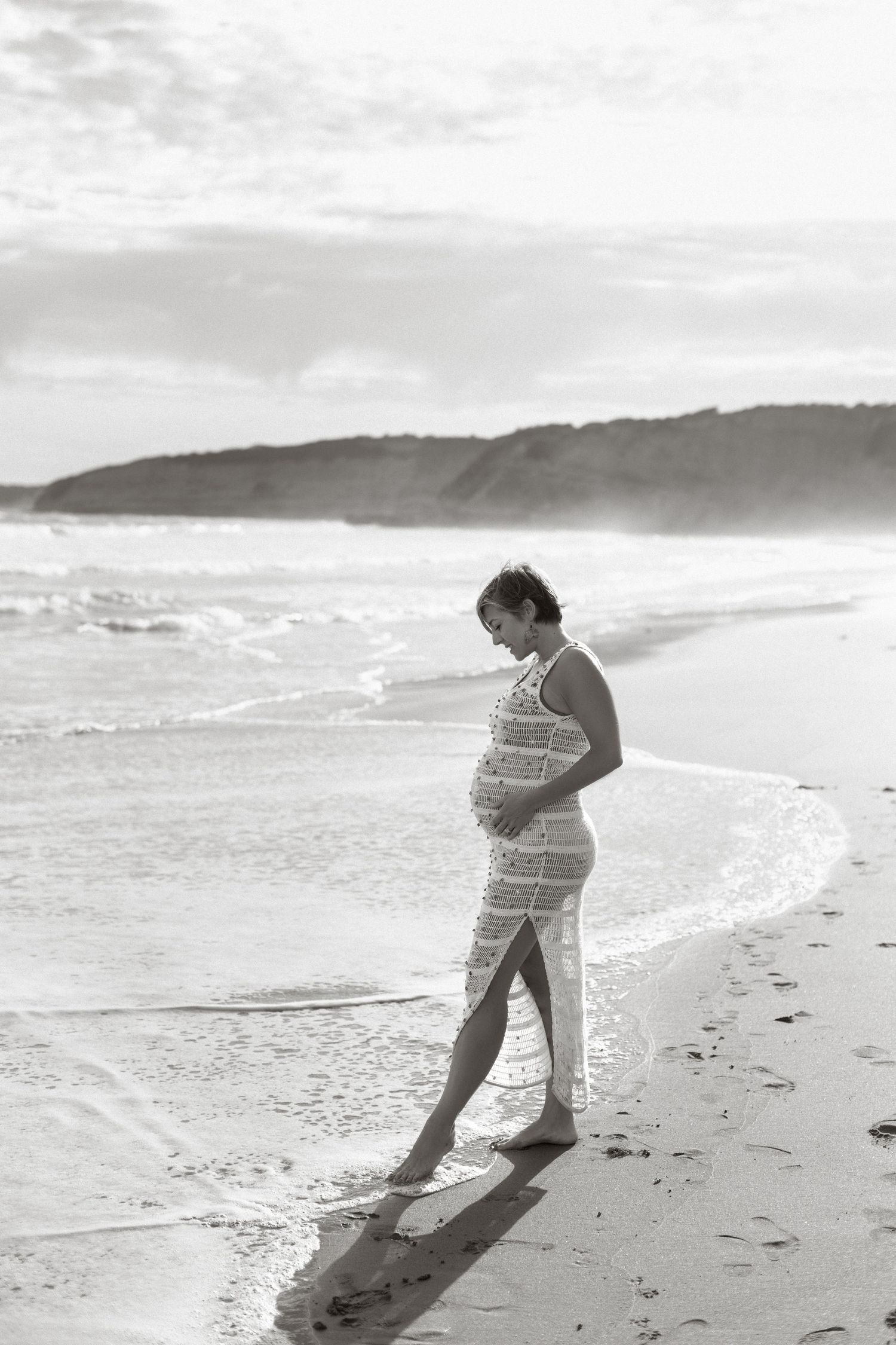 Maternity photography session on the beach during sunset