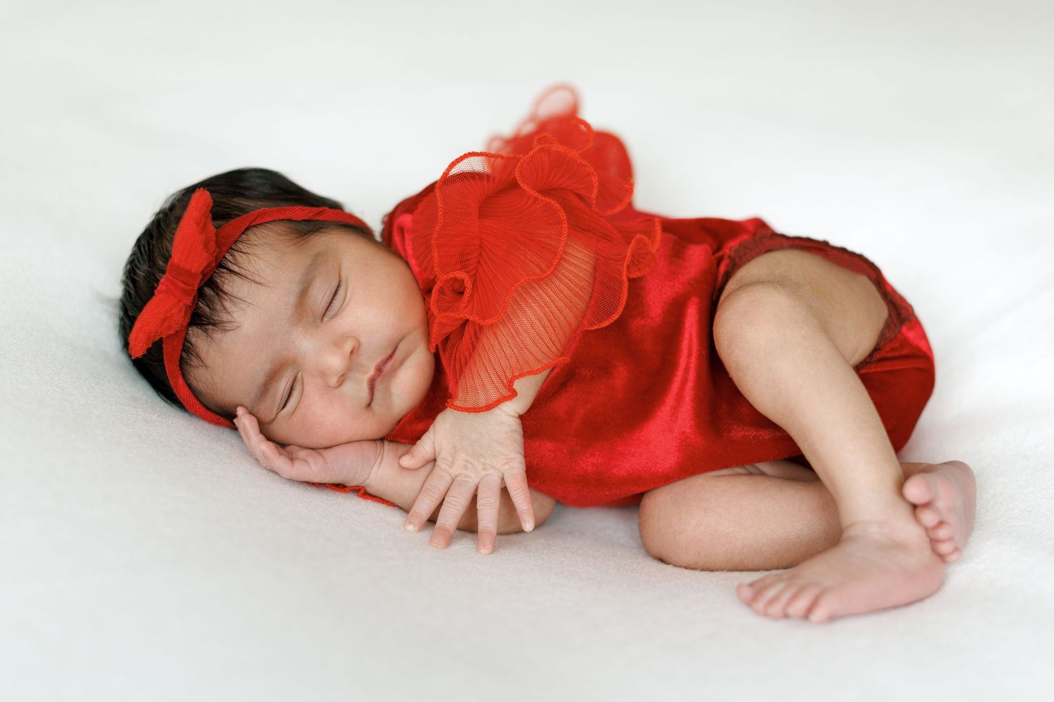 Studio newborn photography capturing a baby in a relaxed environment