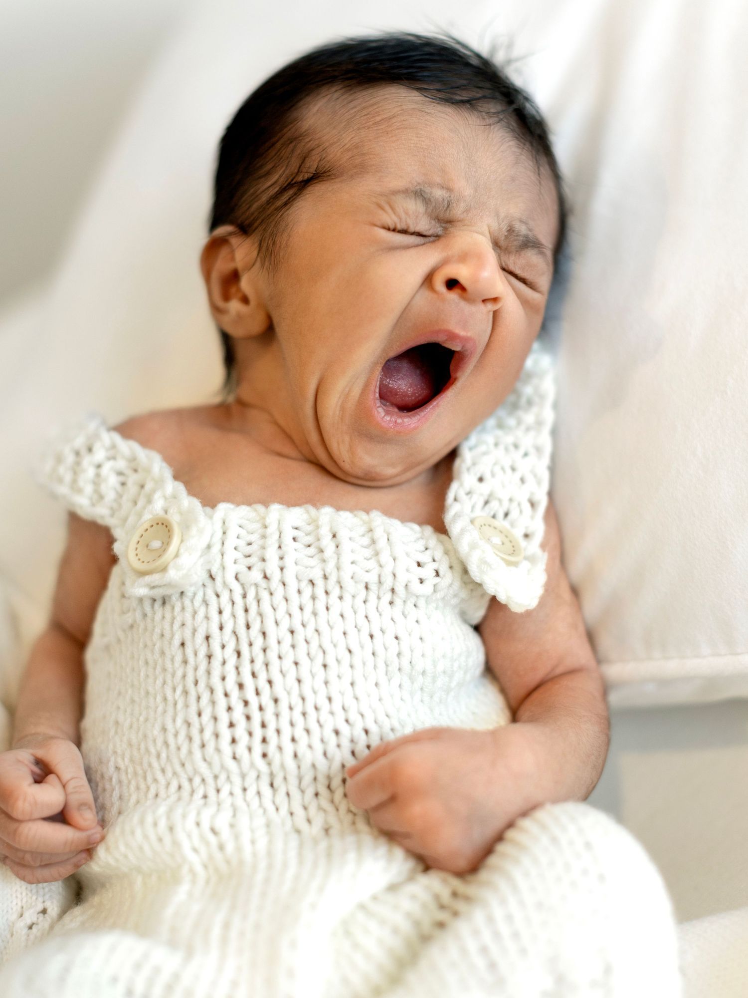 Calm newborn photography portrait with gentle tones
