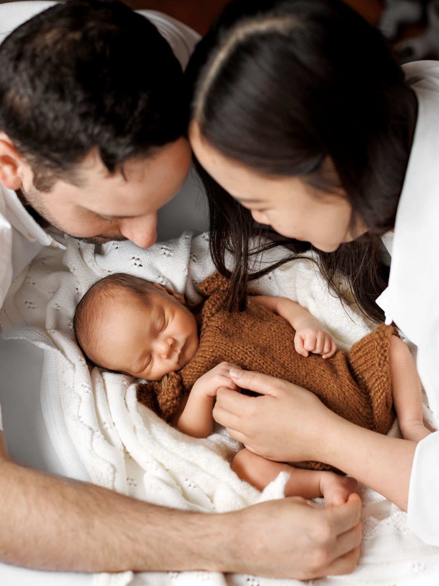 Natural newborn photography portrait with neutral styling