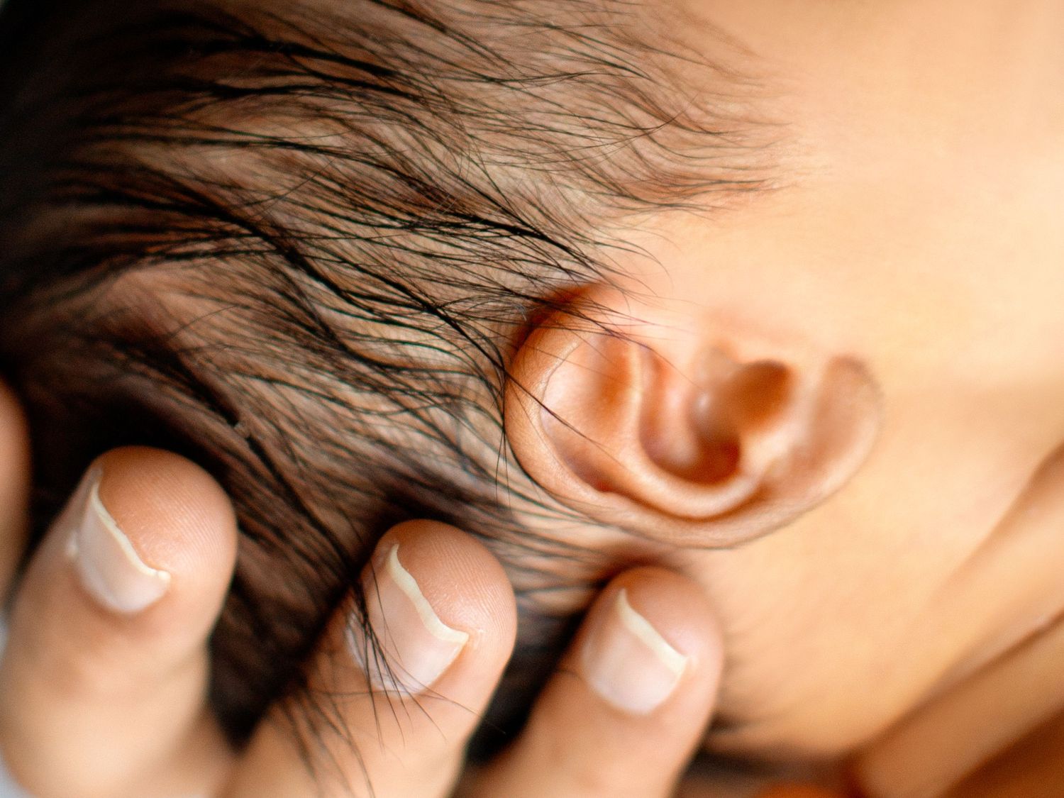 Gentle newborn photography session in a professional studio