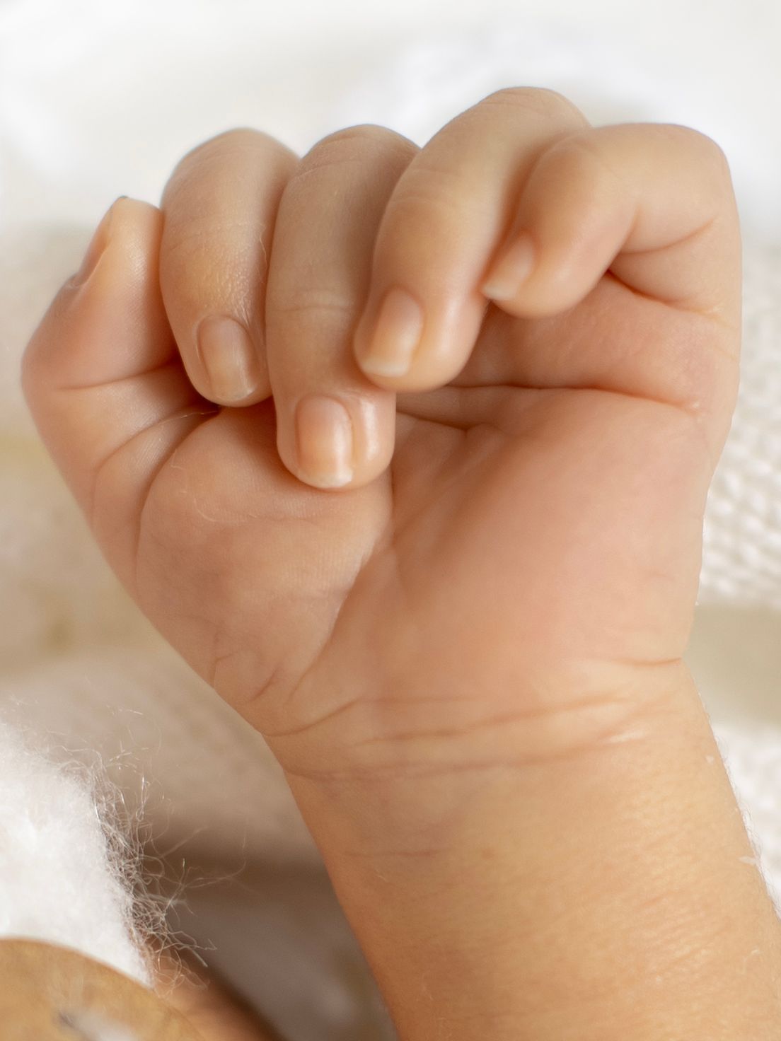 Newborn photography session highlighting tiny baby features