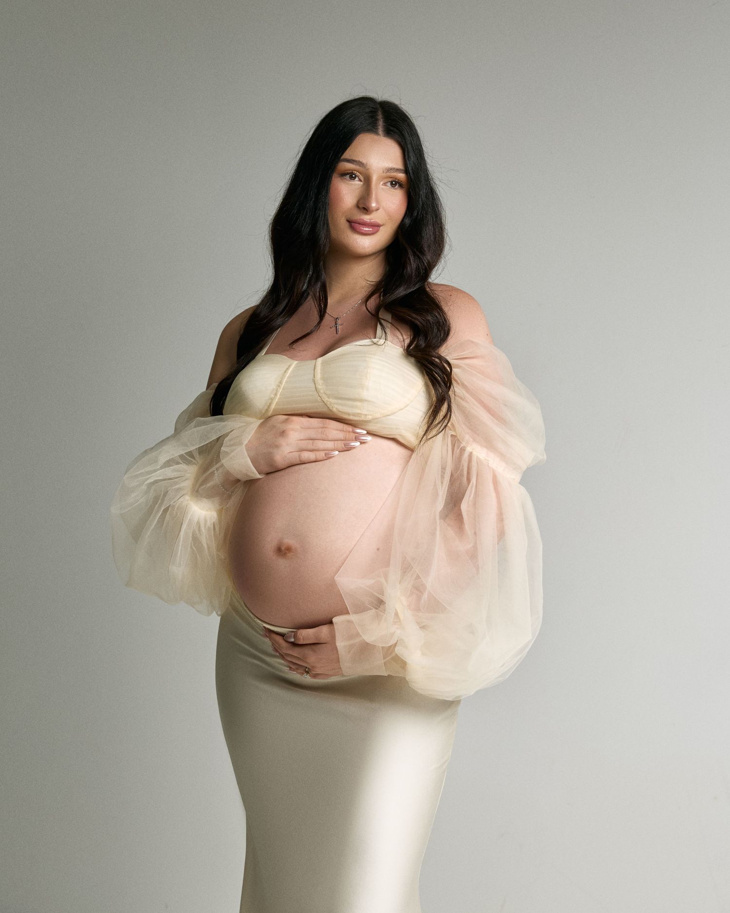 Lifestyle maternity photoshoot capturing authentic pregnancy moments