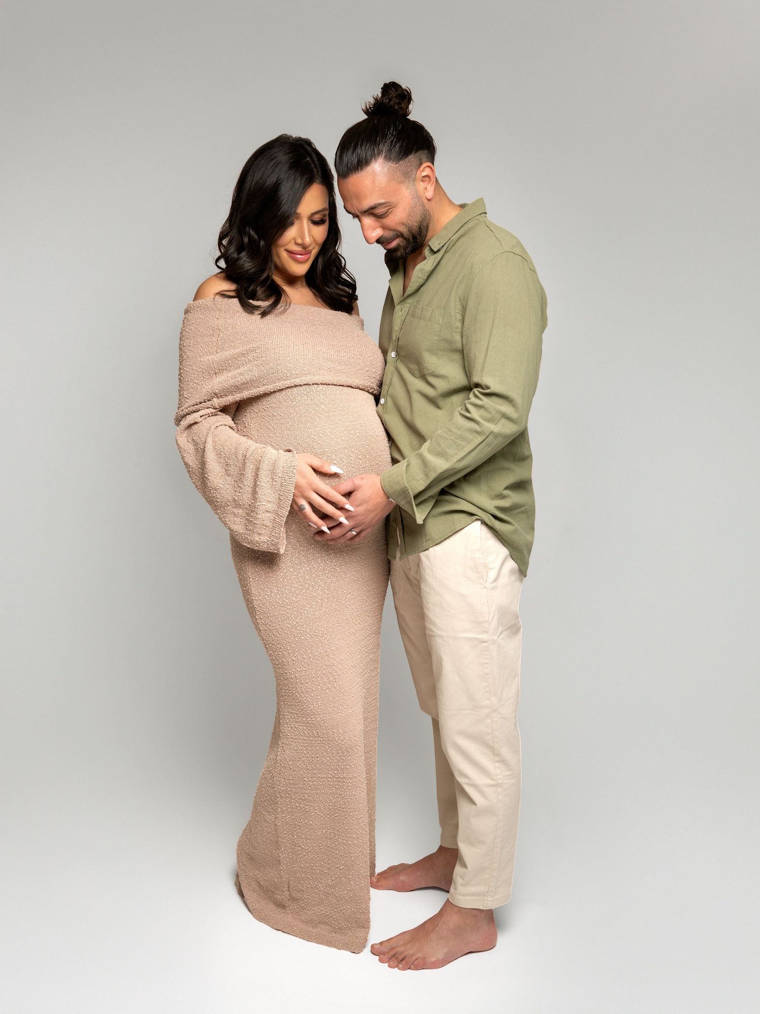 Studio pregnancy photoshoot with natural posing and light