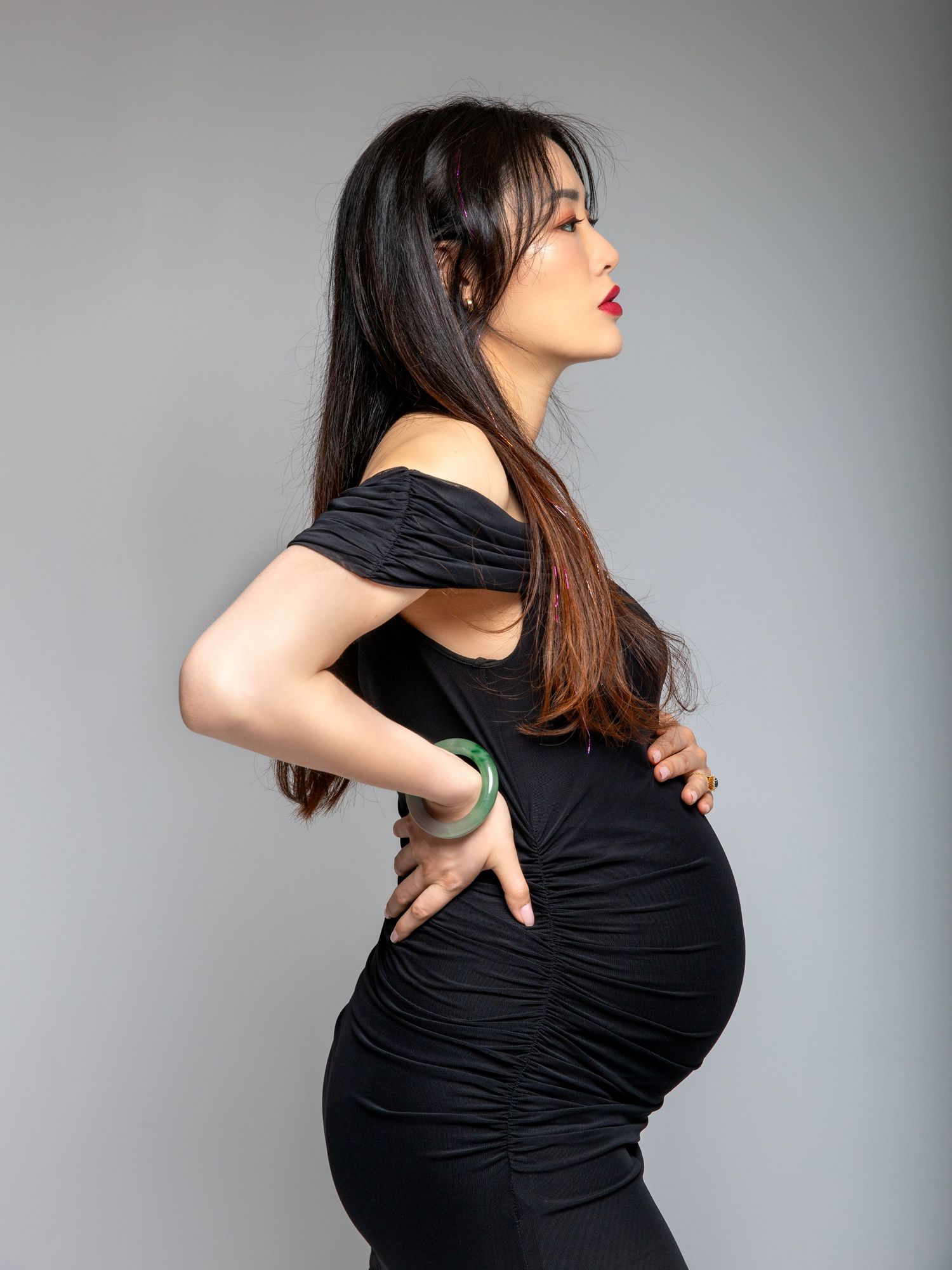 Studio maternity portrait captured with controlled studio lighting