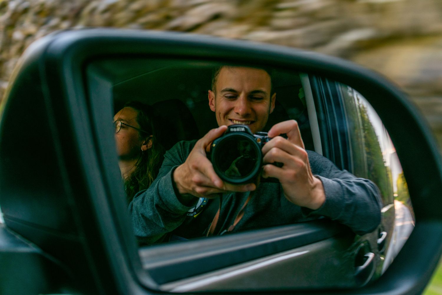 man smiling at camera with a selfie