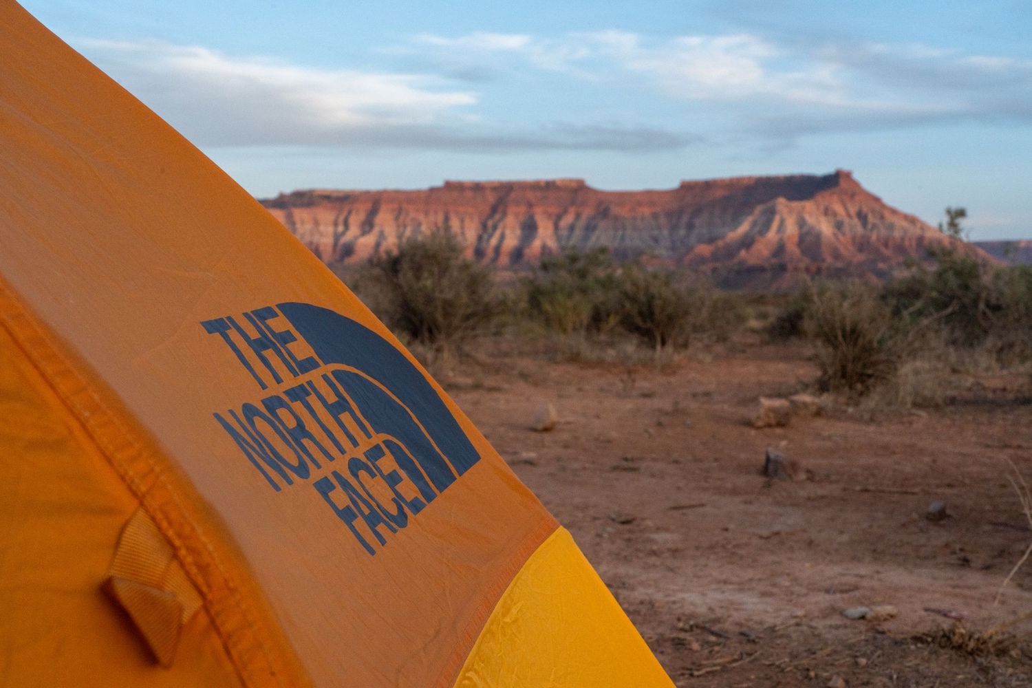 northface tent overlooking desert scene