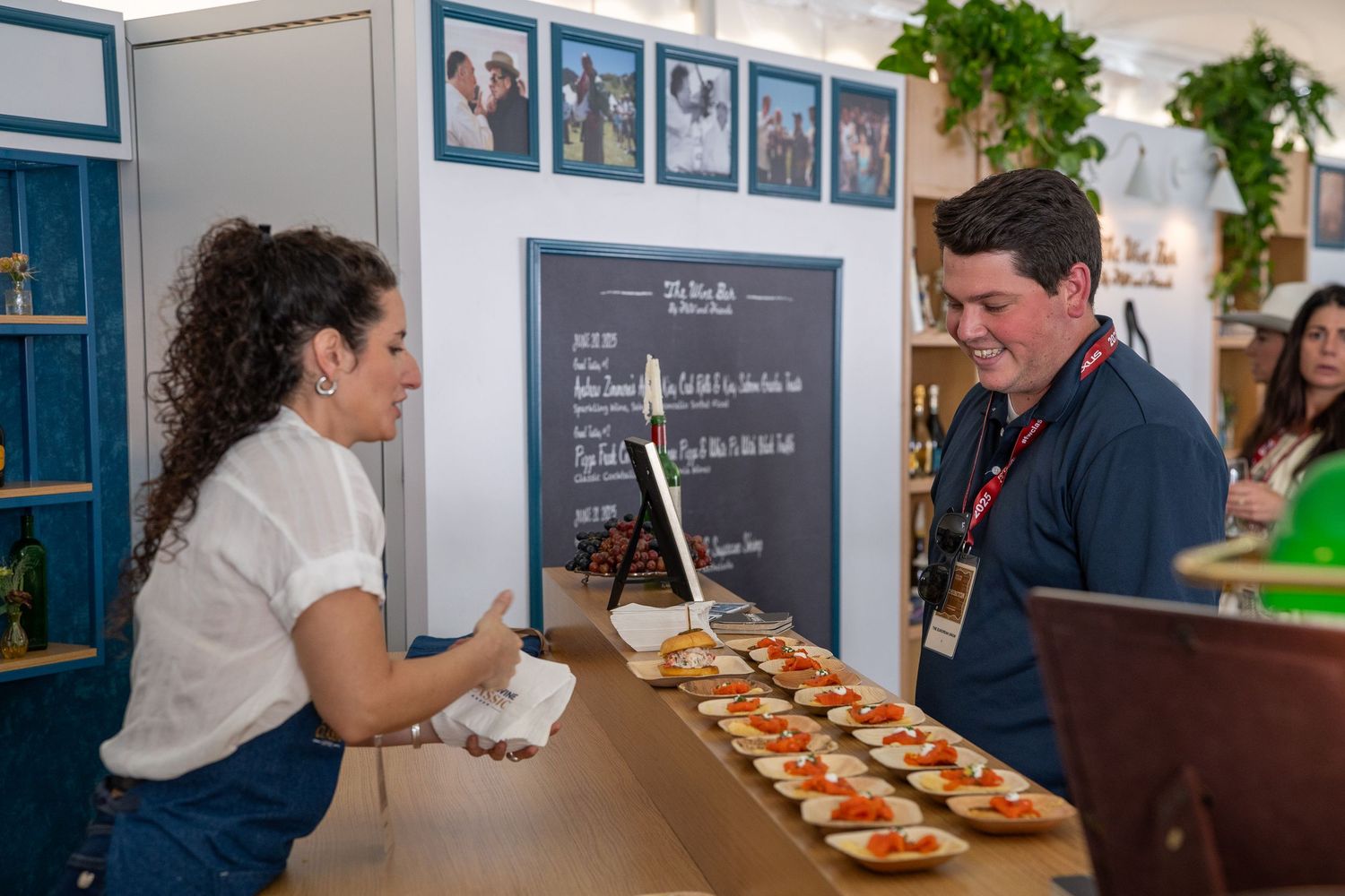 a server helping a man serve a dish