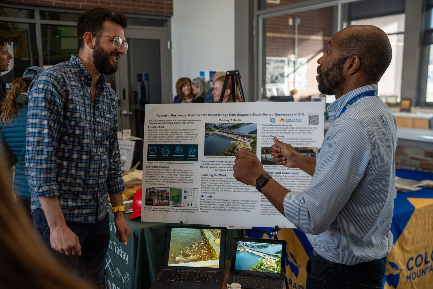 two people talking about a poster