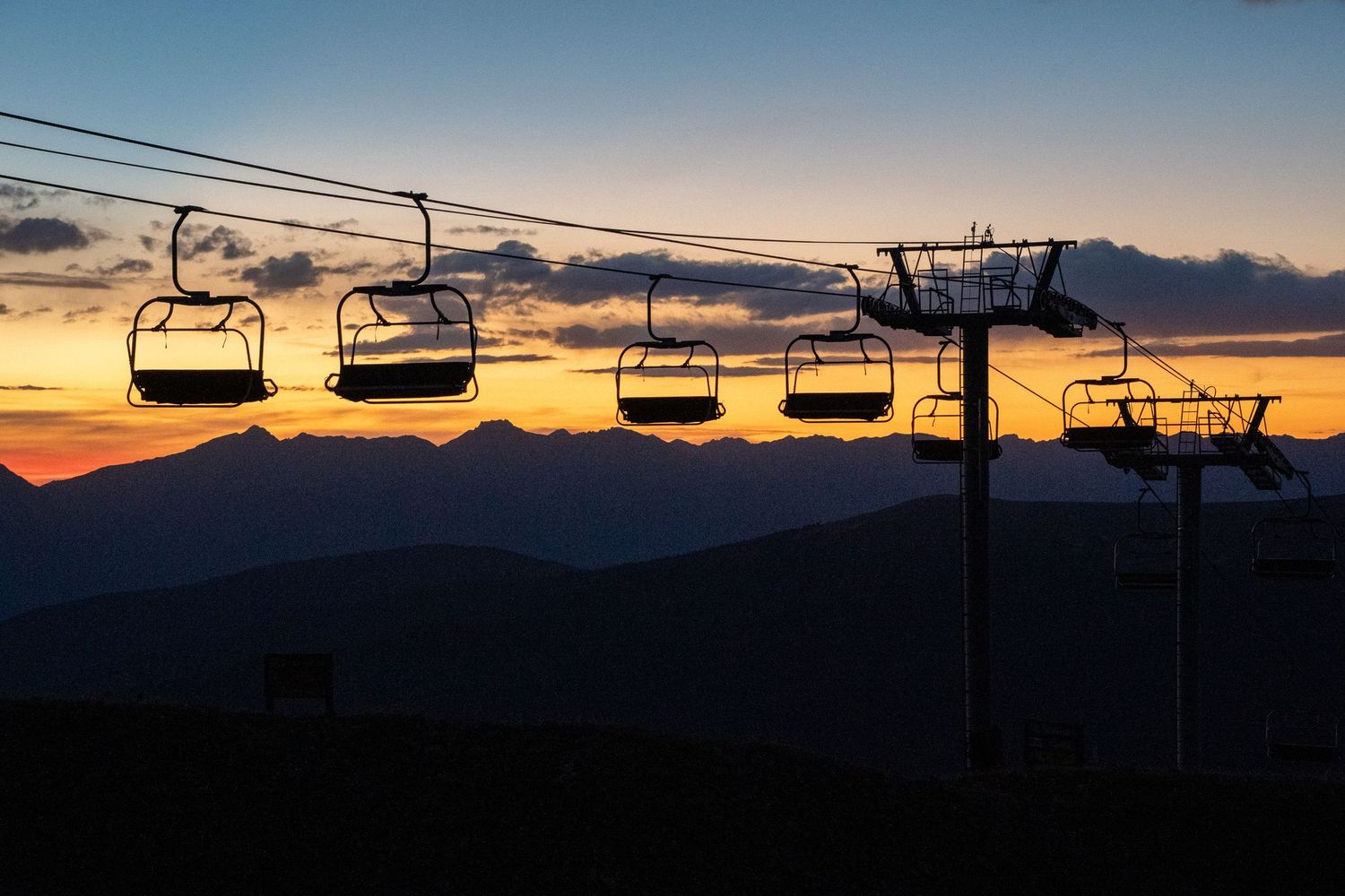sunset over chairlift at arapahoe basin