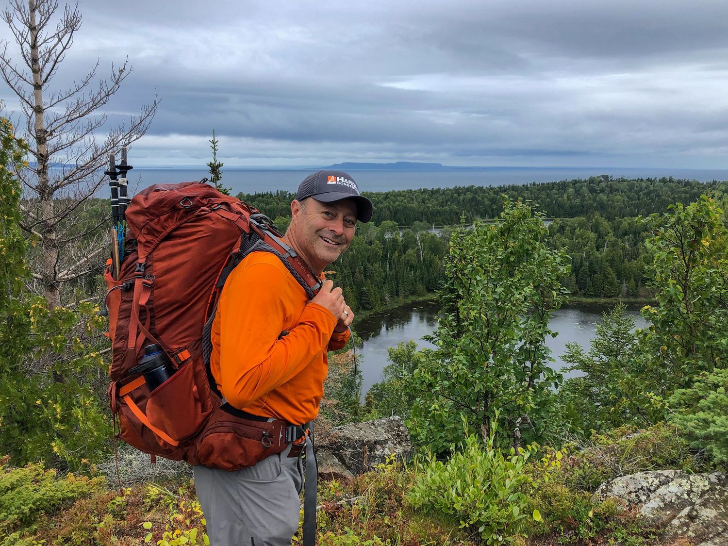 man with hiking bag in isle royale national park michigan