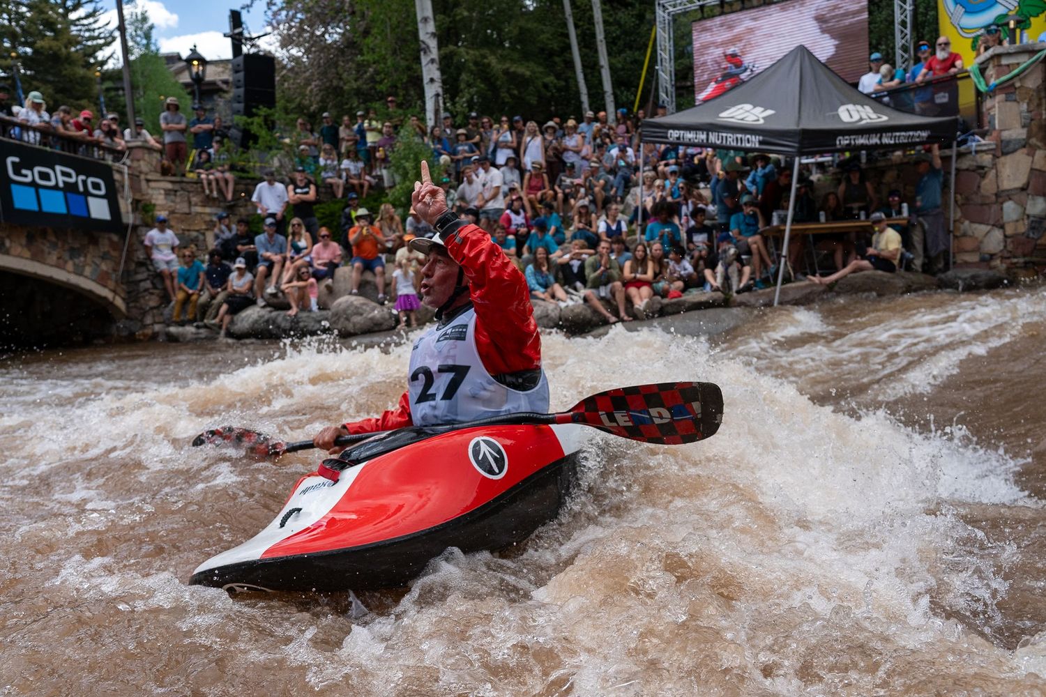 person celebrating their event at kayaking at gopro mountain games