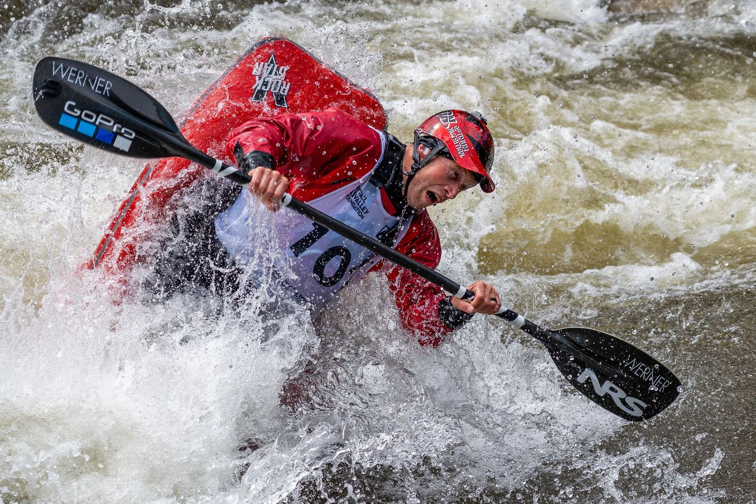 person kayaking during a competition