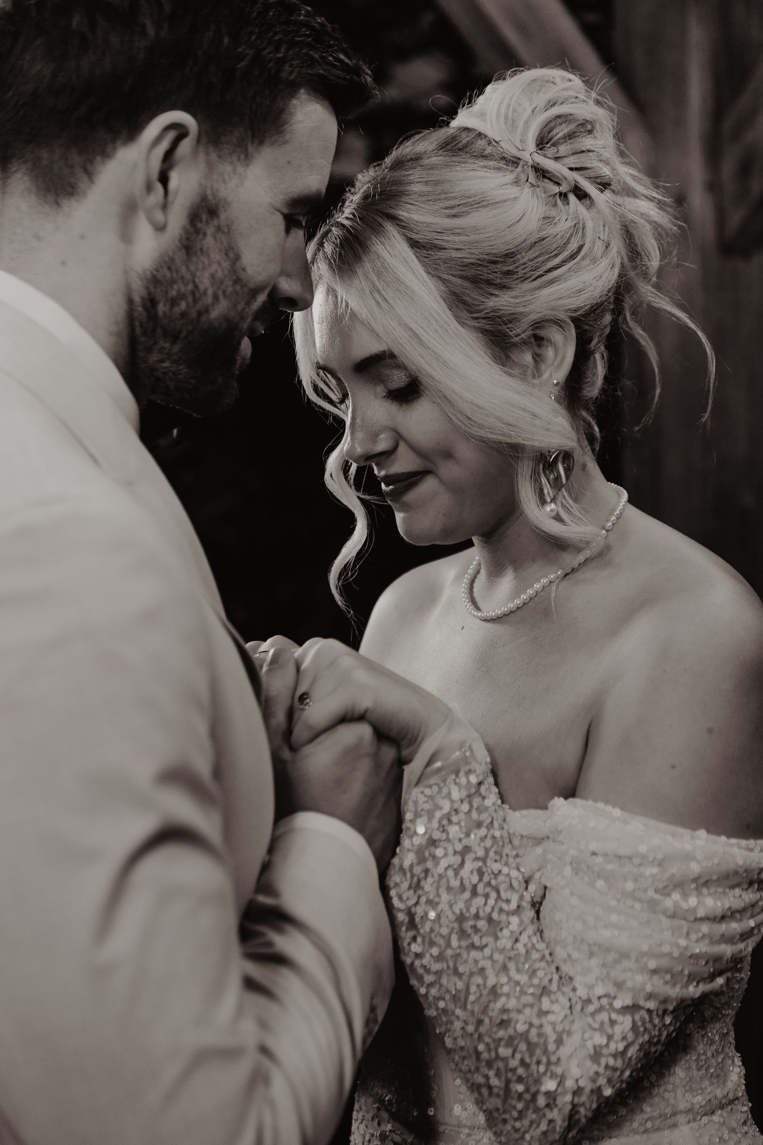 An intimate black and white wedding portrait sequence showing tender romantic moments.