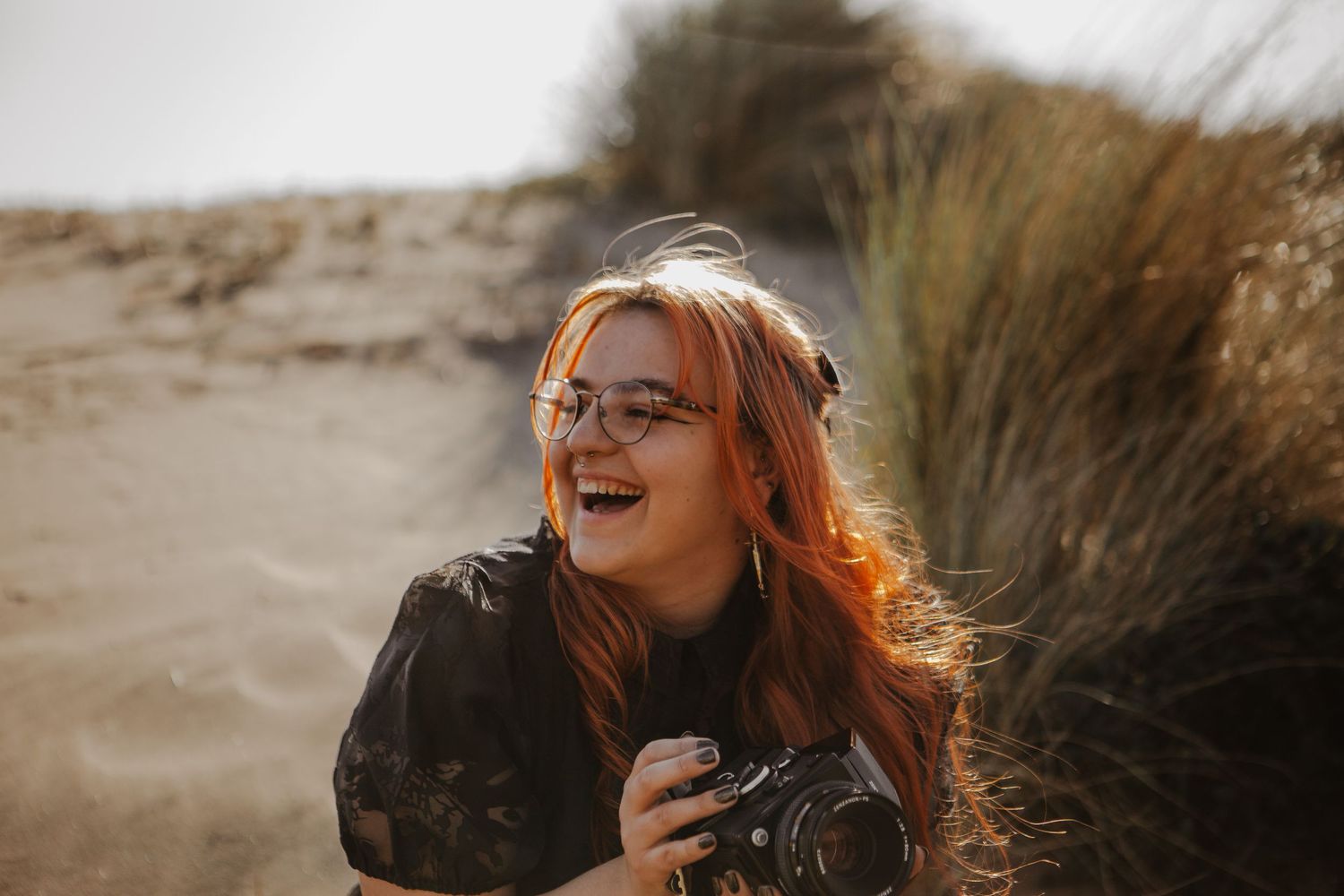 Intimate sunset photoshoot with warm golden lighting and natural scenery.