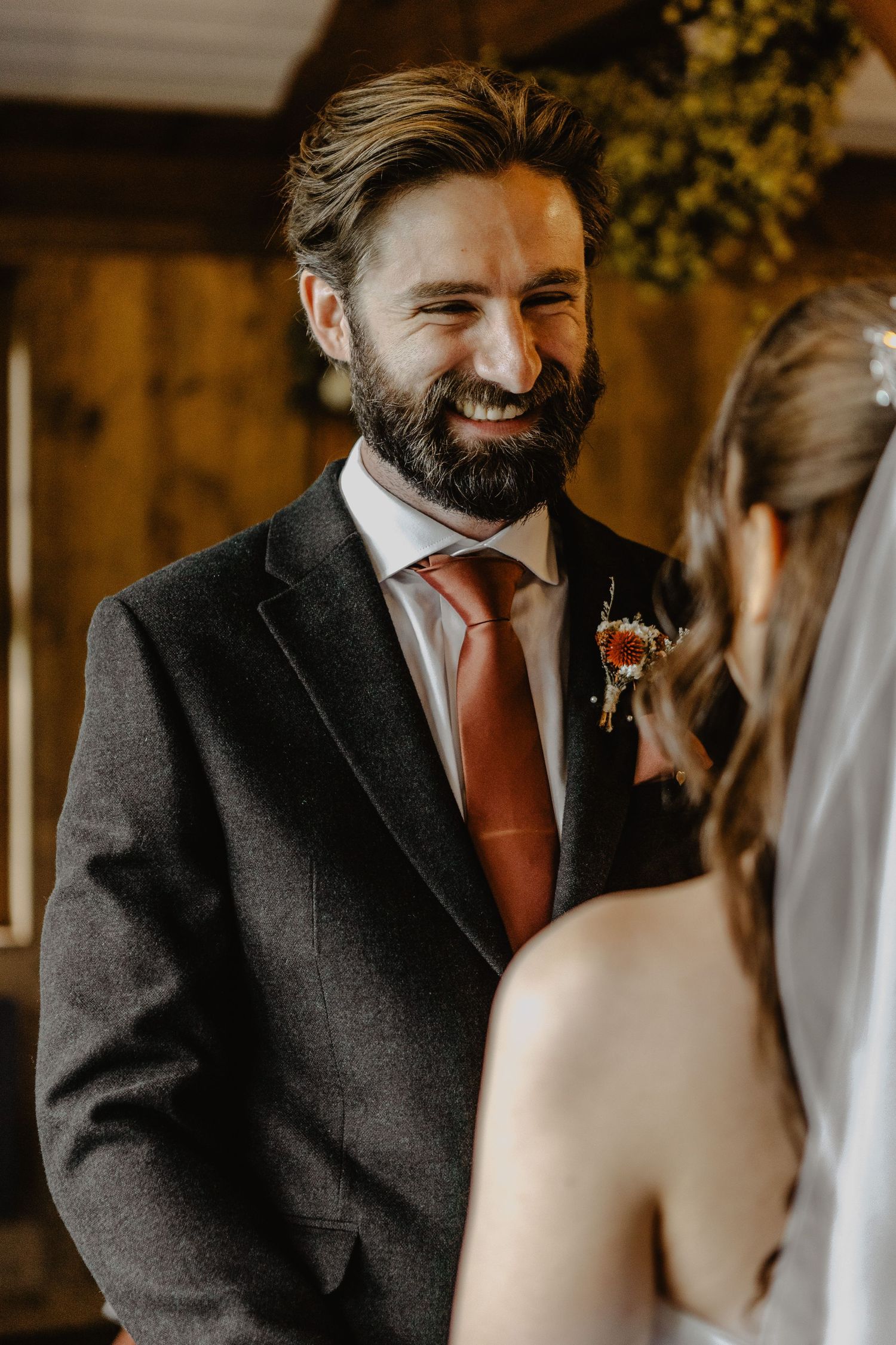 A heartfelt moment shared between a couple during their wedding ceremony, with warm lighting and genuine emotions.