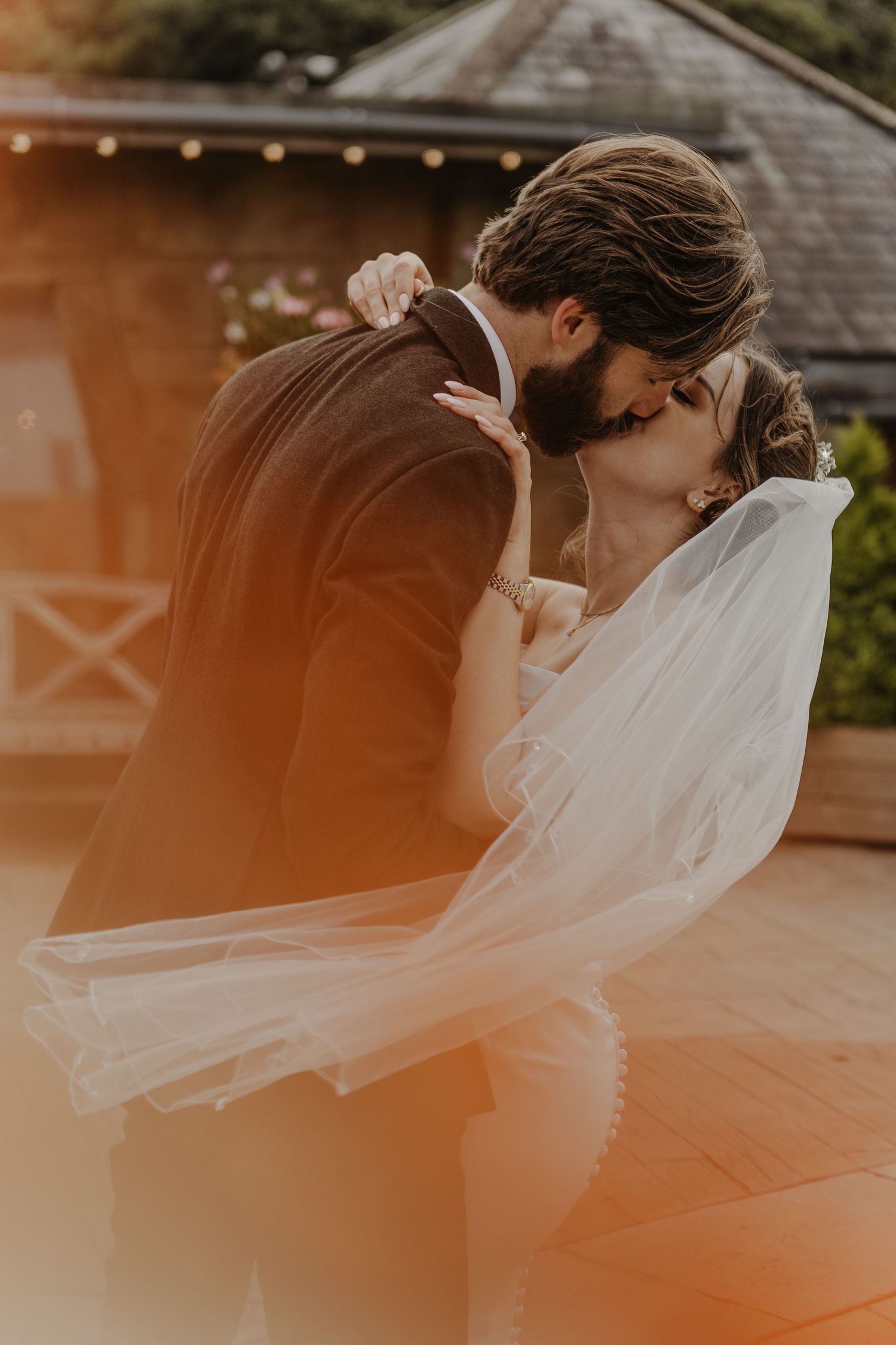 Ethereal veil movement captured during sunset wedding photoshoot.