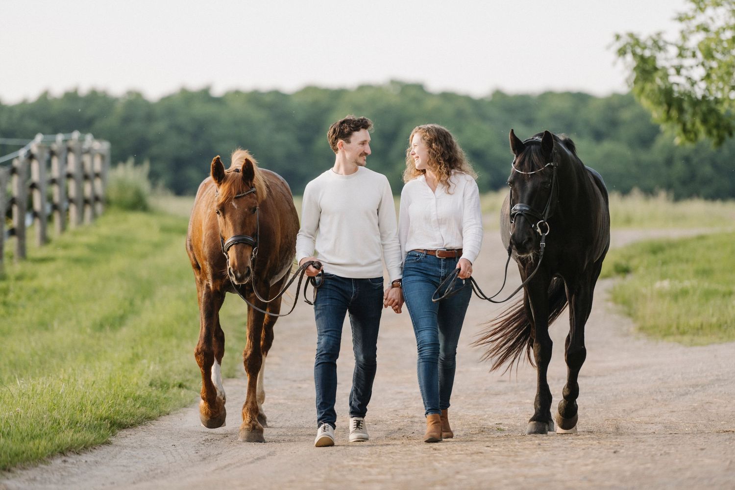 Couple walking with horse for engagement shoot in Kitchener Ontario