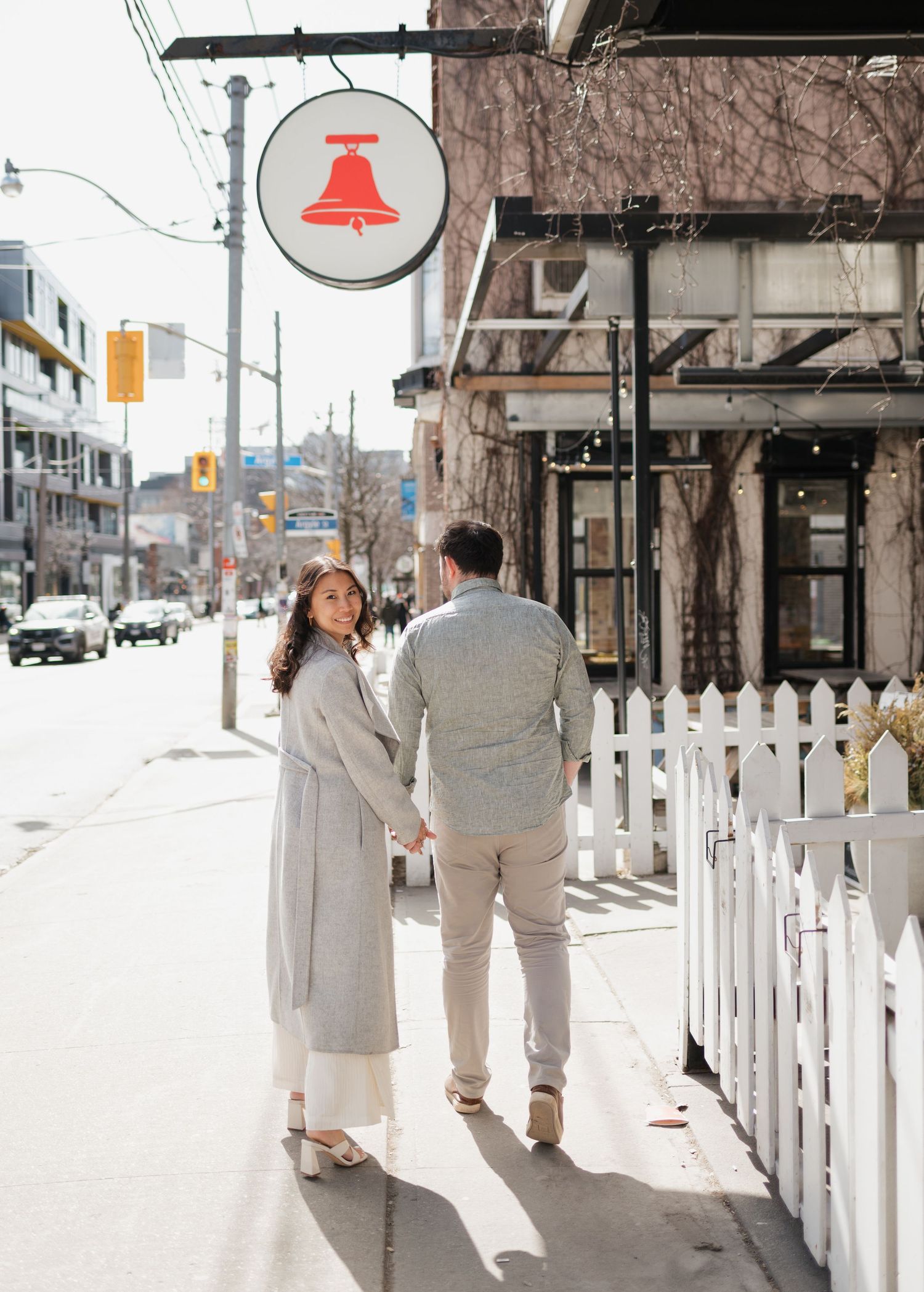 Couple outside at Bellwoods Brewery engagement shoot Toronto Ontario