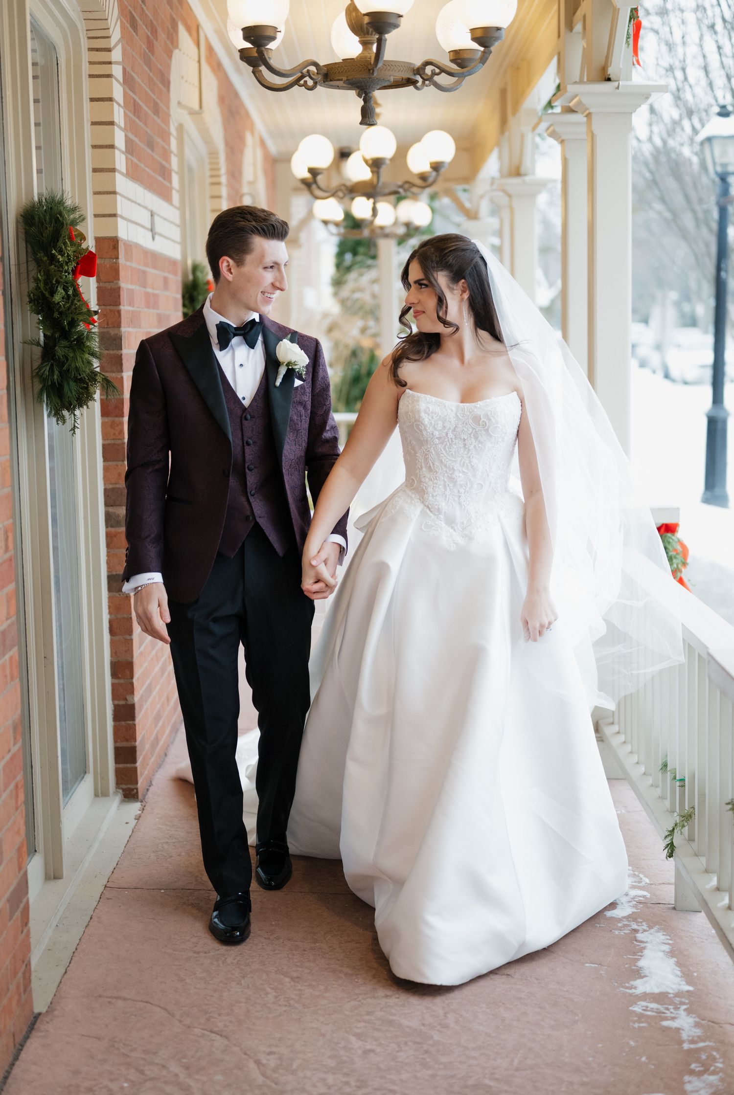 Candid couple walking outside Prince of Wales Hotel Niagara on the Lake Ontario wedding photography
