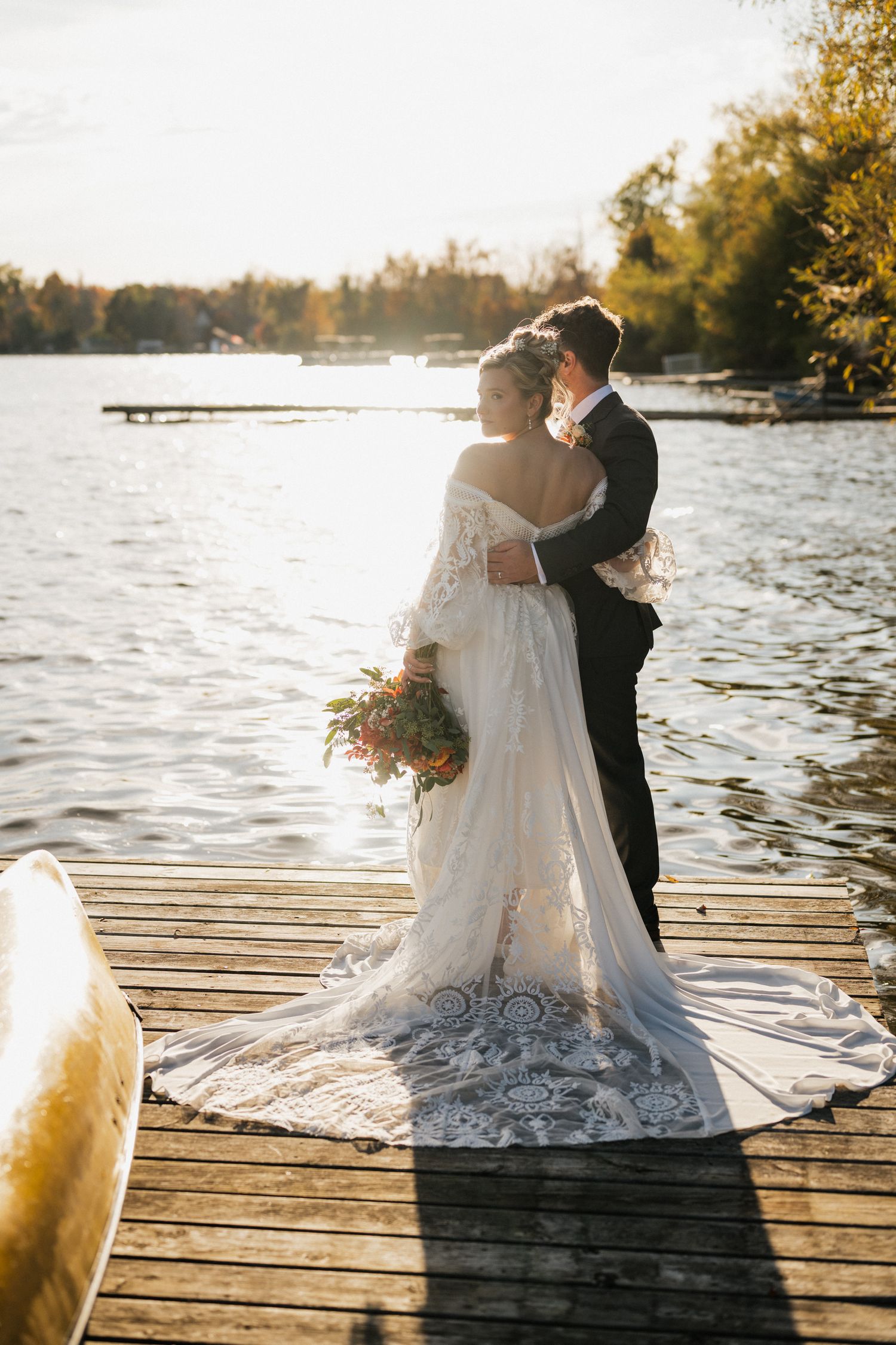 Couple standing on the dock at Elmhirst Resort, Keene Ontario