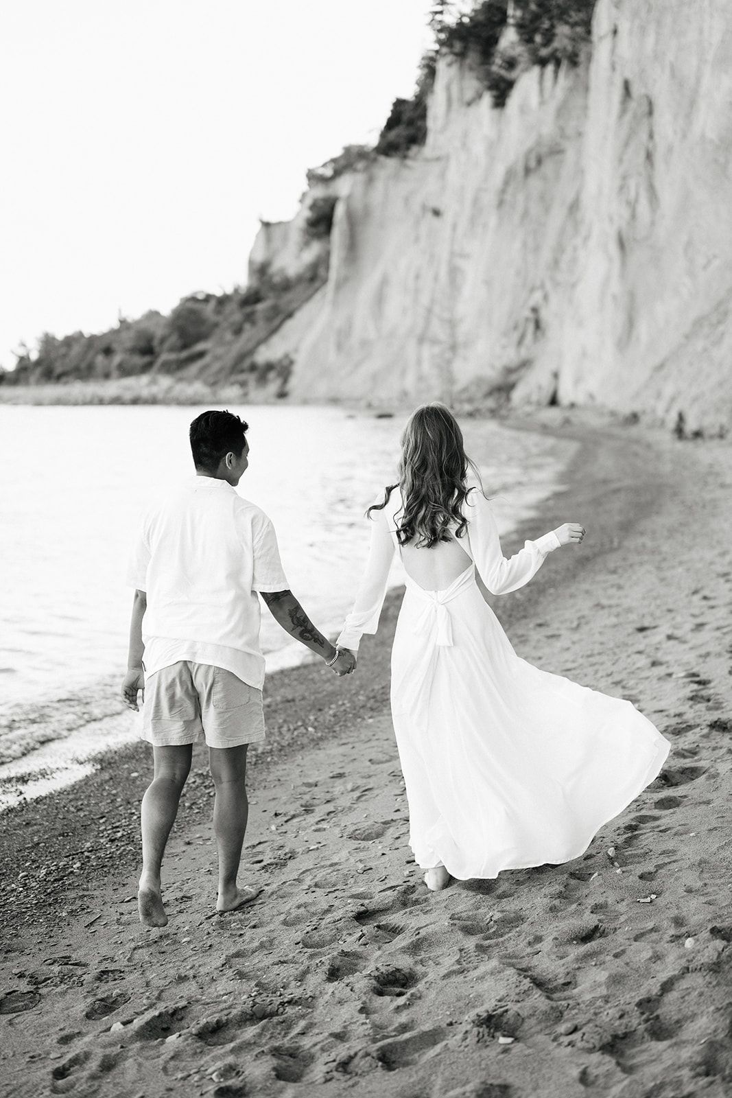Couple walking away during engagement shoot at Scarborough Bluffs, Toronto Ontario
