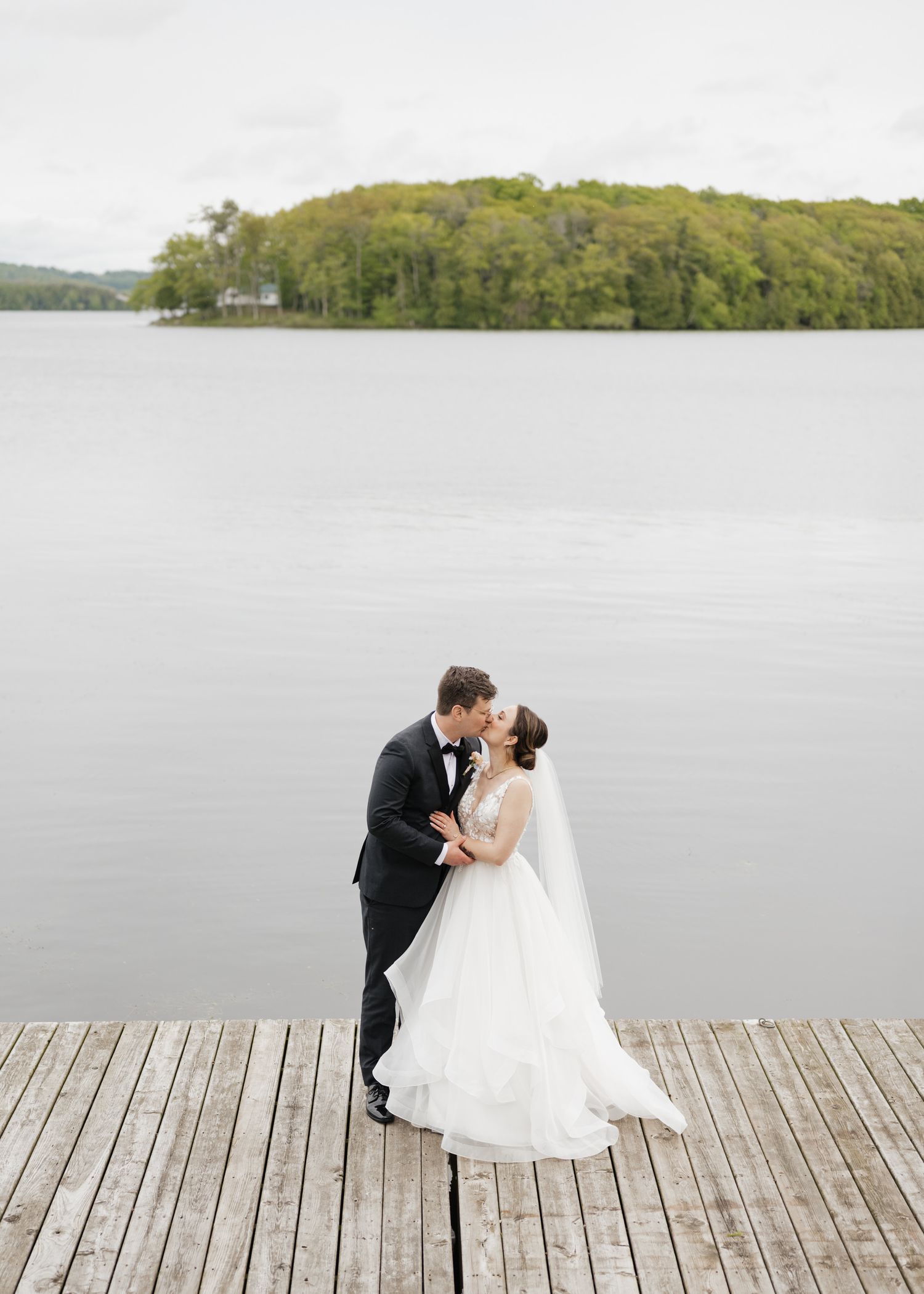 Couples candid dock photo at Elmhirst Resort, Keene ON