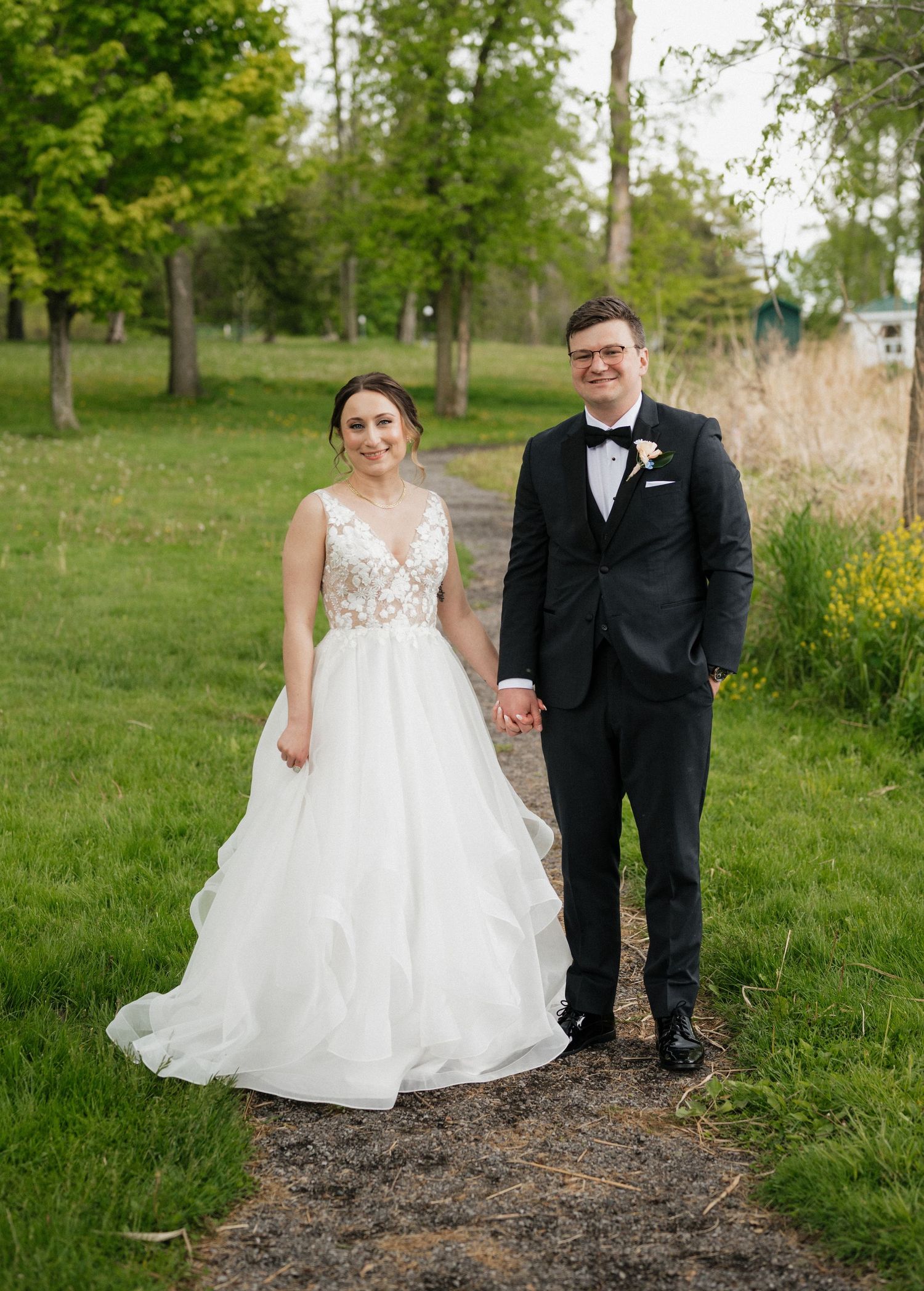 Couple walking hand in hand through the grounds at Elmhirst Resort Keene Ontario