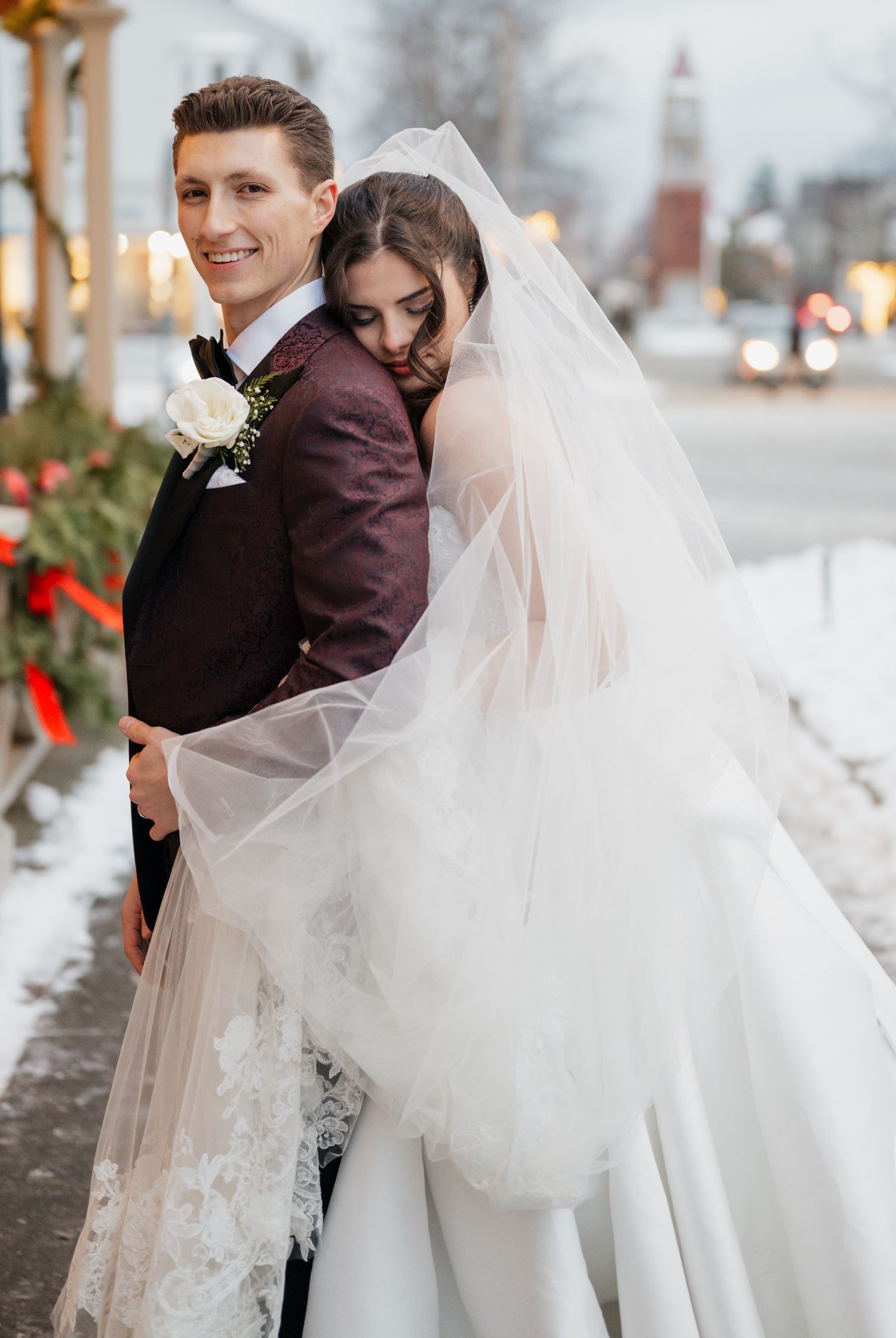 Couple hugging at Queen of Wales hotel in Niagara on the Lake