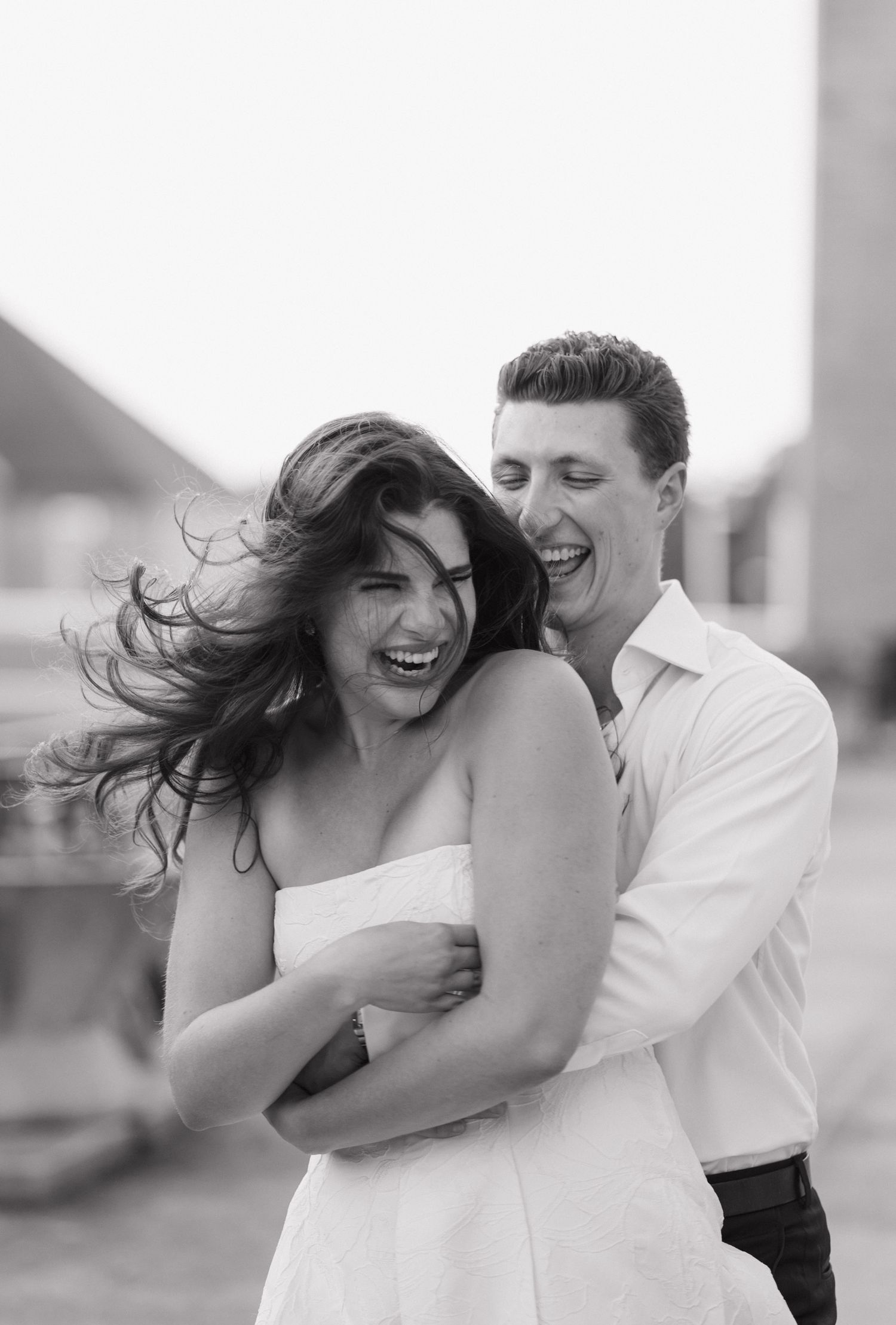 Candid close up of couple laughing during engagement session at Tyndale University Toronto