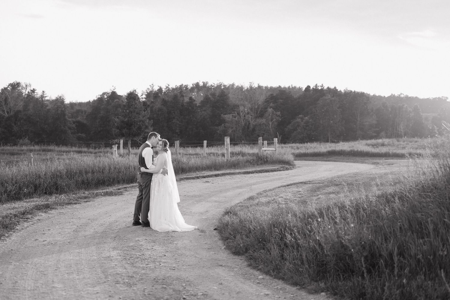 Couple walking down laneway at elmhirst resort, keene