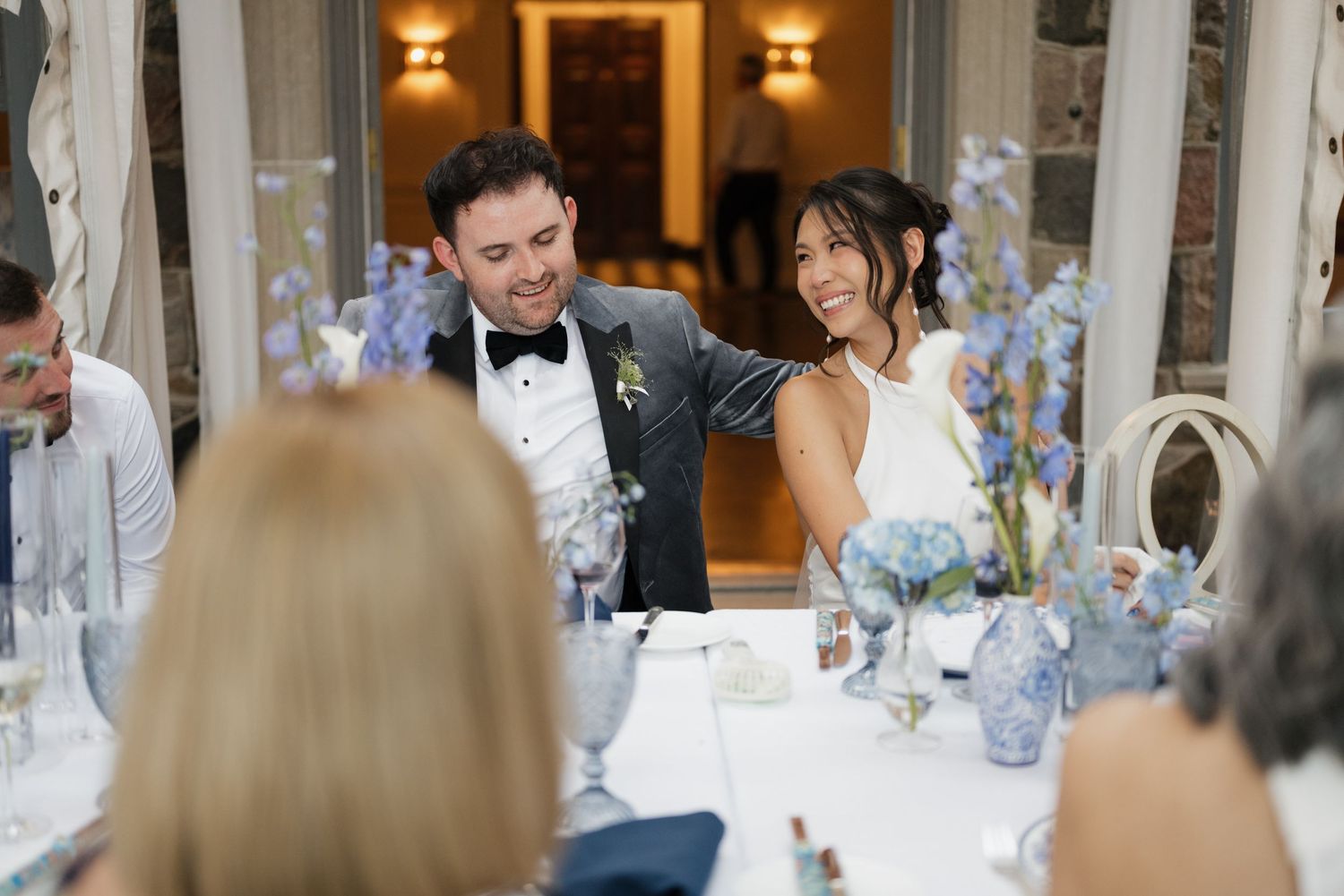 Couple laughing during speeches at Graydon Hall Manor, Toronto